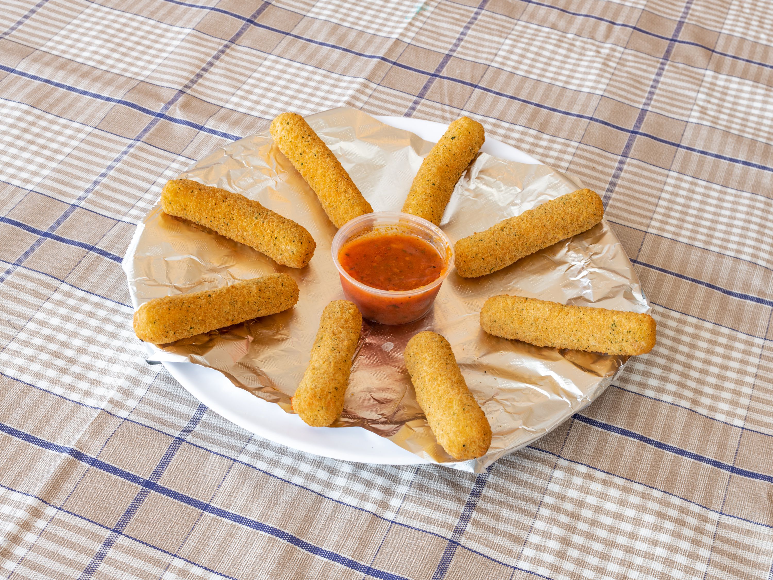 Order 1. Mozzarella Sticks with Sauce food online from Milano's Pizza store, Waxahachie on bringmethat.com