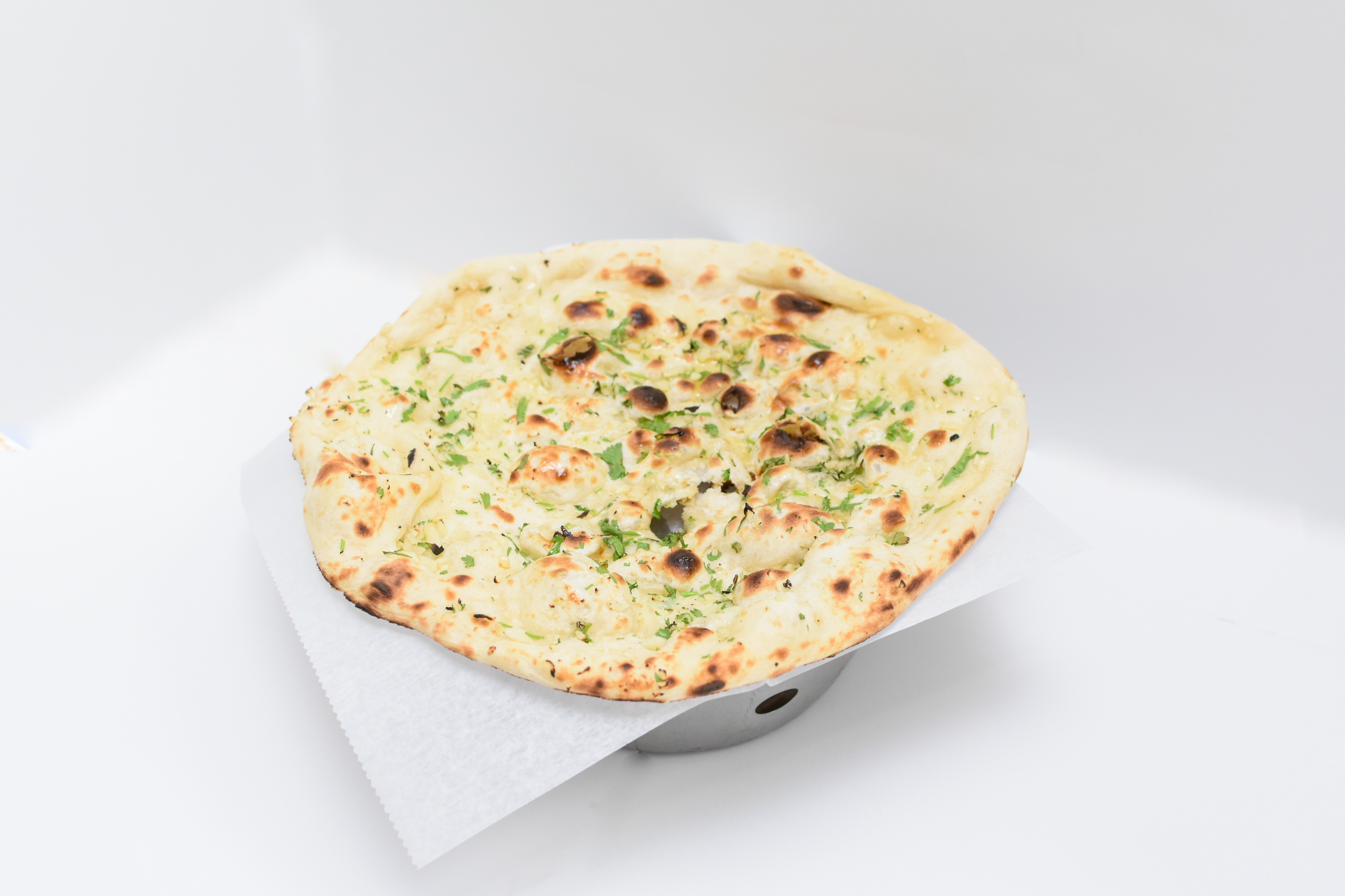 Order Garlic Naan food online from Sher-A-Punjab store, Quincy on bringmethat.com
