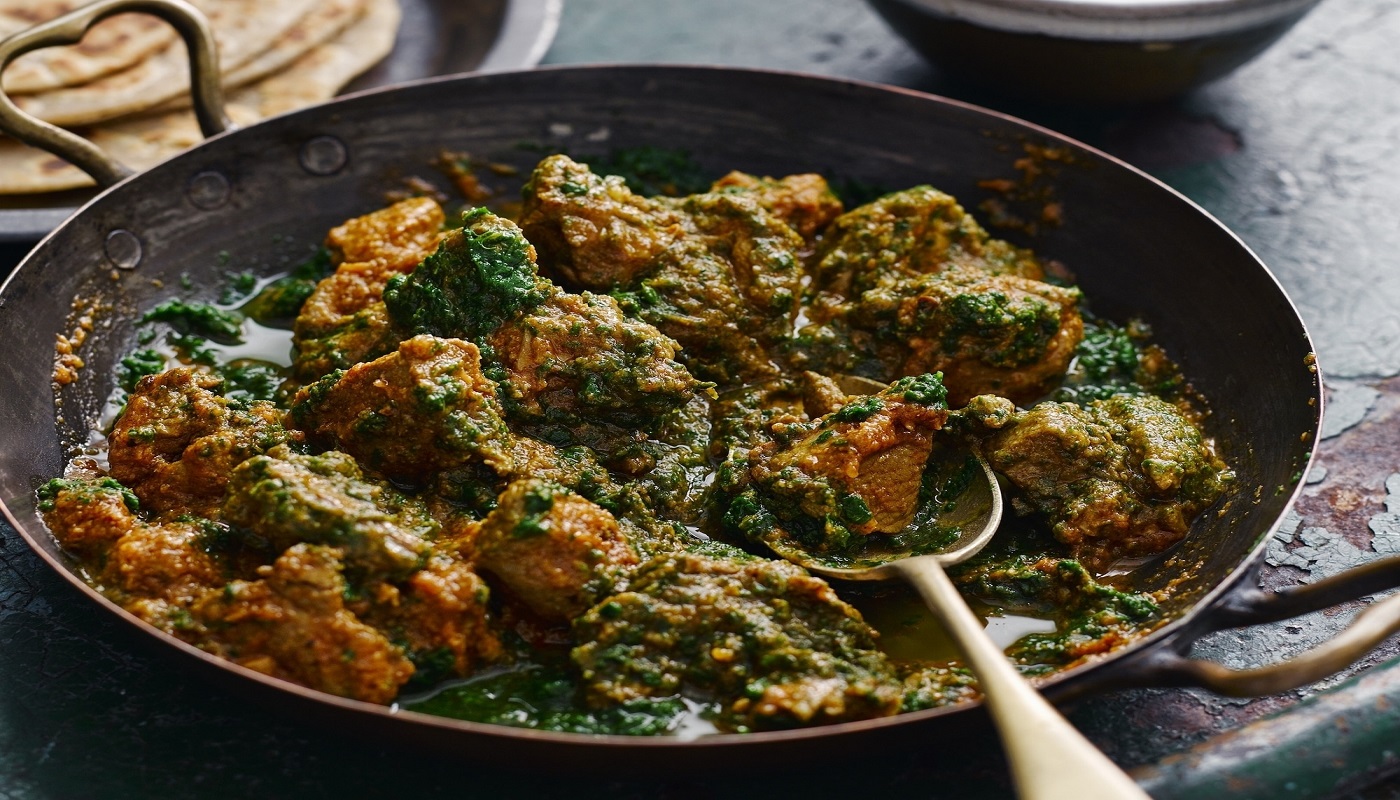 Order Lamb Saag food online from Aroma Indian Cuisine store, Ann Arbor on bringmethat.com