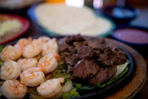 Order Steak & Shrimp Fajitas food online from Frontera Mex-Mex Grill store, Suwanee on bringmethat.com