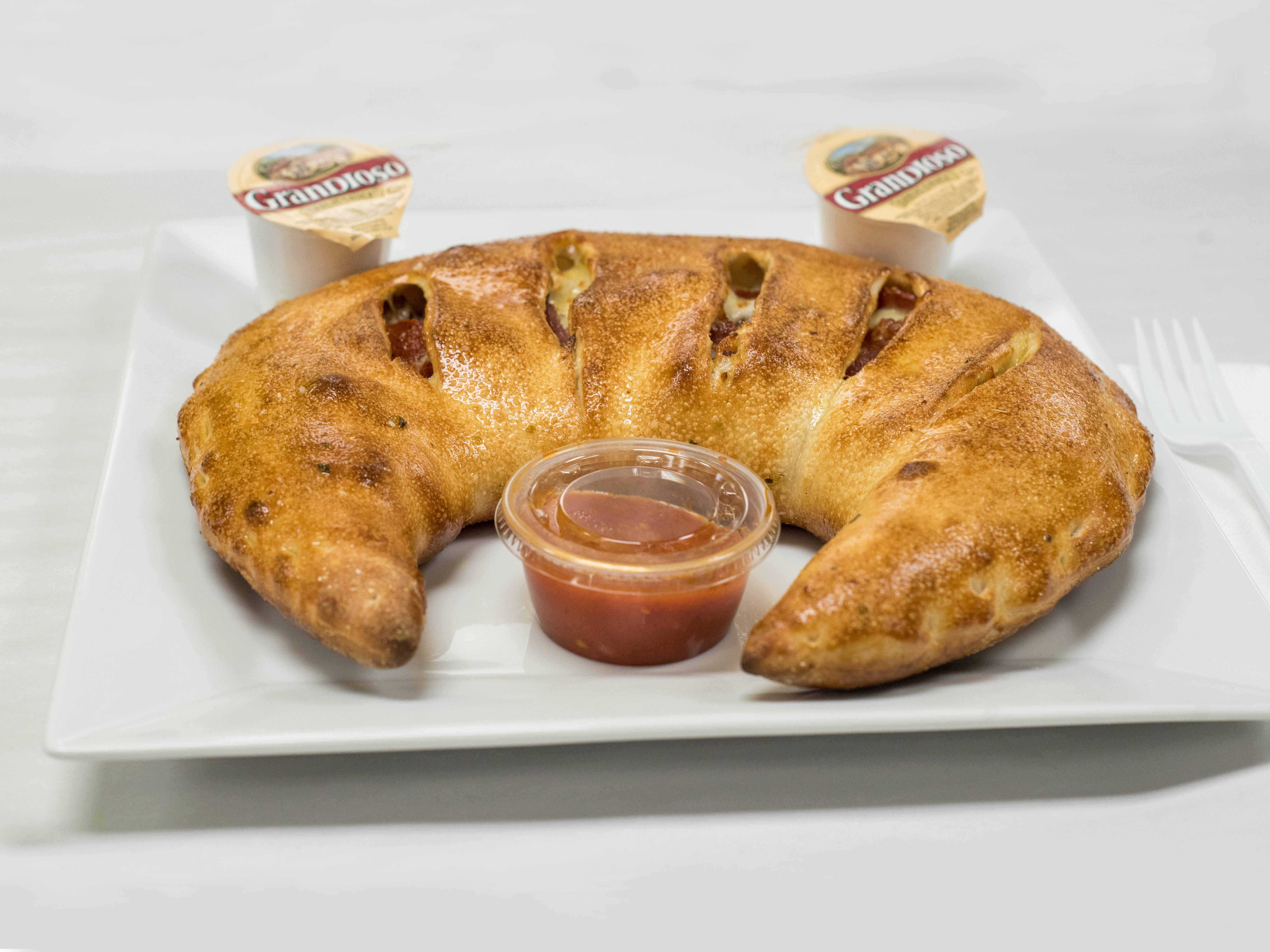 Order Meat Calzone food online from Pizza Wings & More store, Reisterstown on bringmethat.com