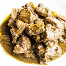 Order Curry Goat with Roti food online from Limins Cafe Caribe store, East Orange on bringmethat.com