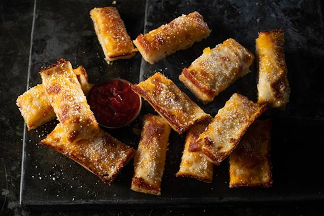 Order Jet’s Triple Cheese Turbo Stix food online from Jet Pizza store, Murfreesboro on bringmethat.com