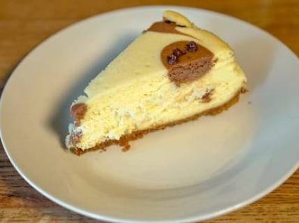Order Spotted Cow Cheesecake food online from Lindey's Prime Steak House store, Arden Hills on bringmethat.com