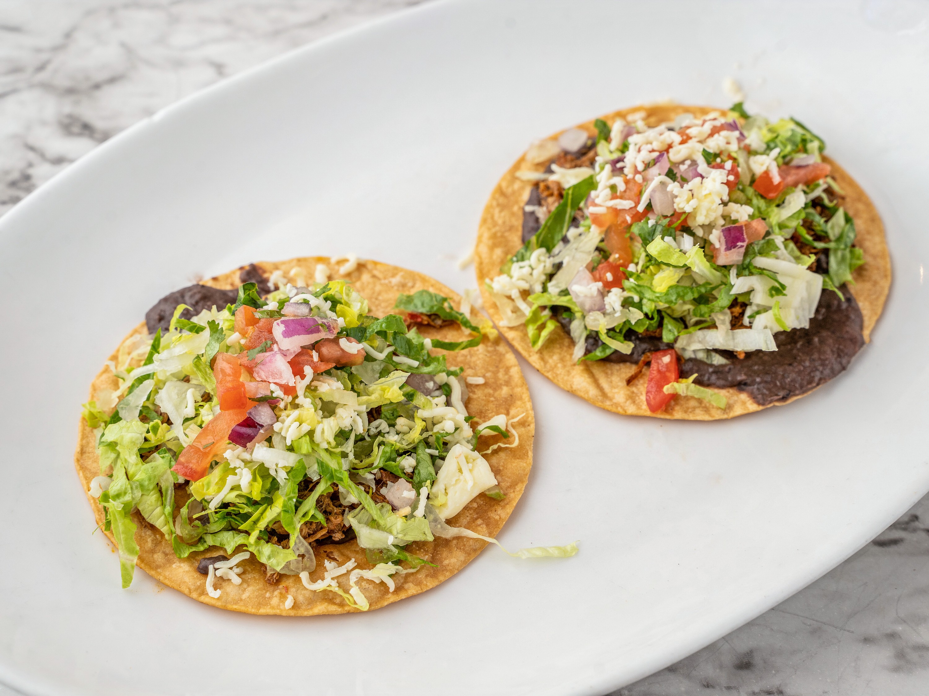 Order Tostadas food online from Zocalo Street Food | Tequila store, Wilmington on bringmethat.com