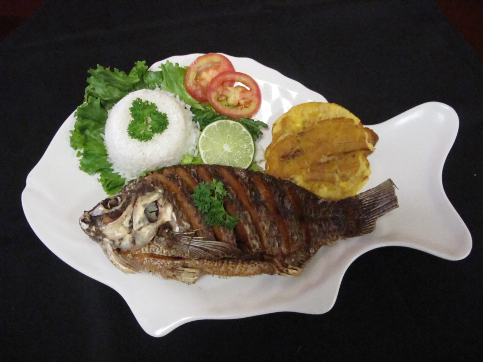 Order Whole Fried Tilapia food online from La Olla Restaurant store, Houston on bringmethat.com