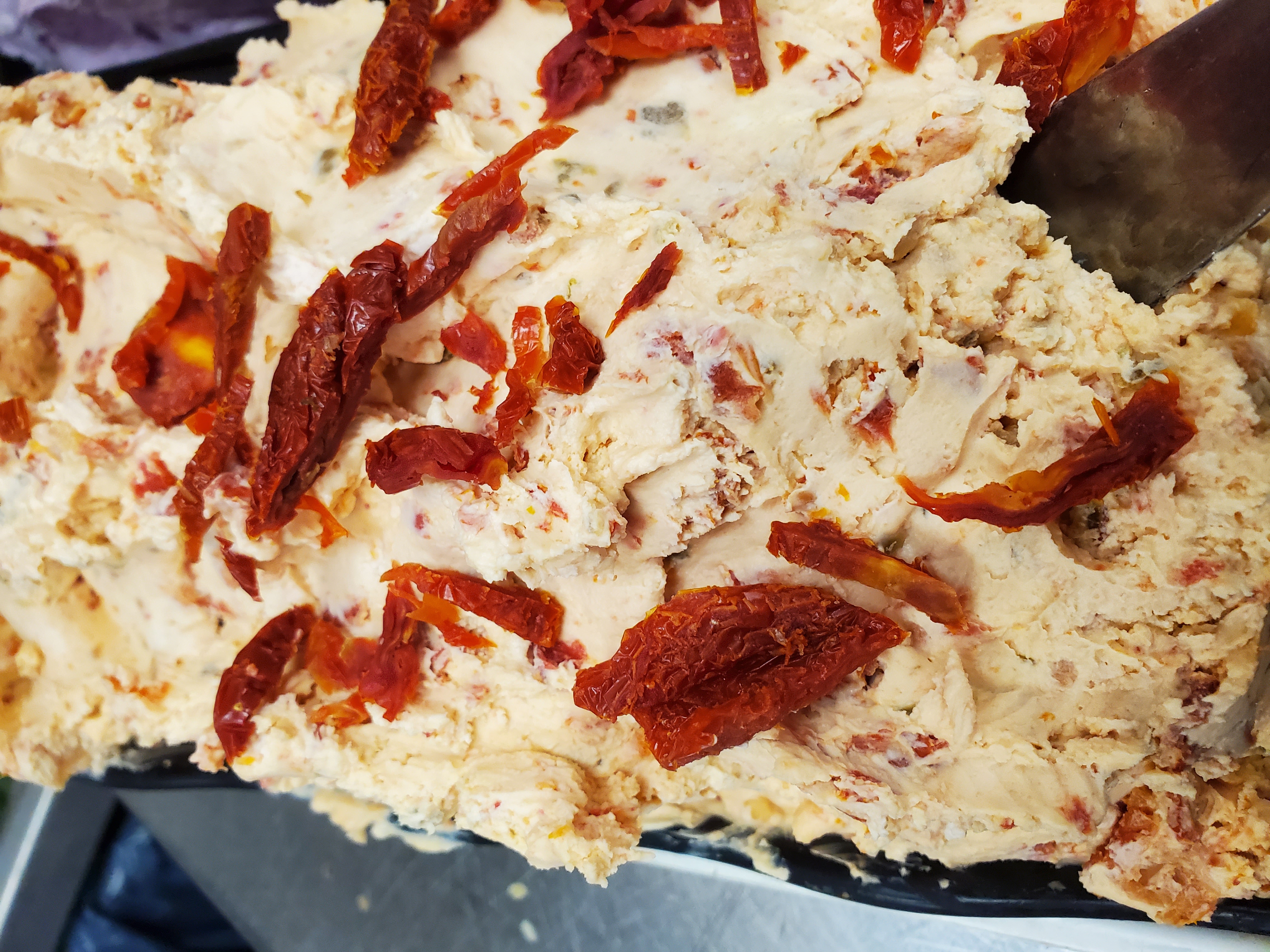 Order 1/2 lb. Sun-Dried Tomato Jalapeno Cream Cheese food online from East Northport Bagel Cafe store, East Northport on bringmethat.com