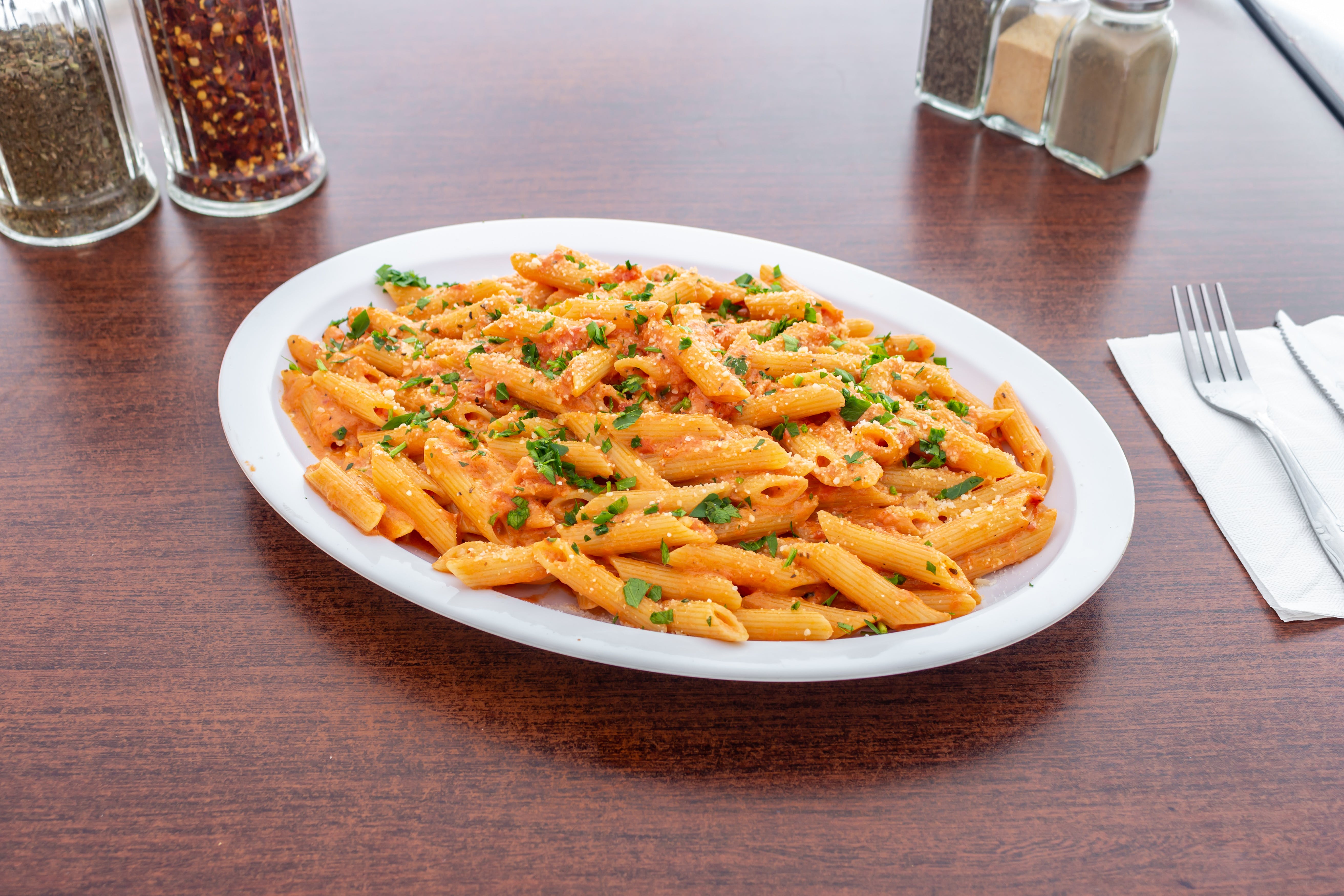 Order Penne Vodka - Pasta food online from Sopranos Pizzeria store, New Milford on bringmethat.com