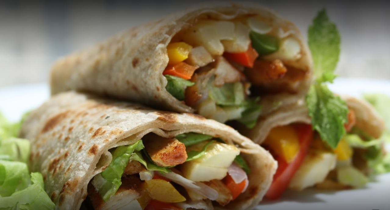 Order Chicken Caesar Wrap - Wrap food online from Linda's Pizza store, Bronx on bringmethat.com