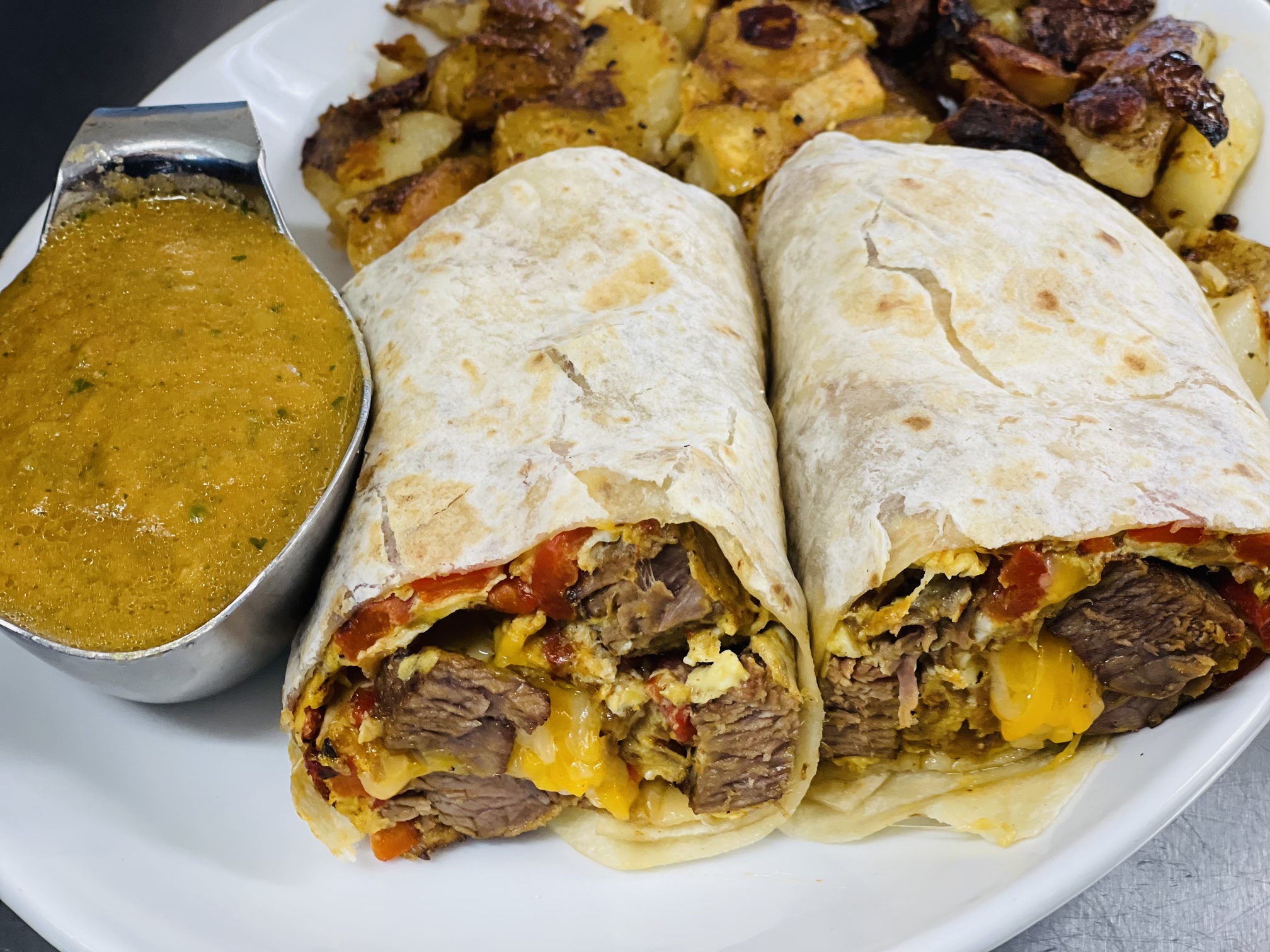 Order NEW "OLA" STEAK BURRITO food online from State Street Cafe store, North Haven on bringmethat.com