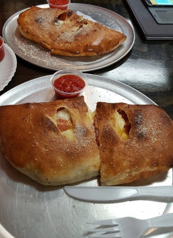 Order Specialty Calzone - Calzone food online from Stone Oven Downtown store, Wichita Falls on bringmethat.com