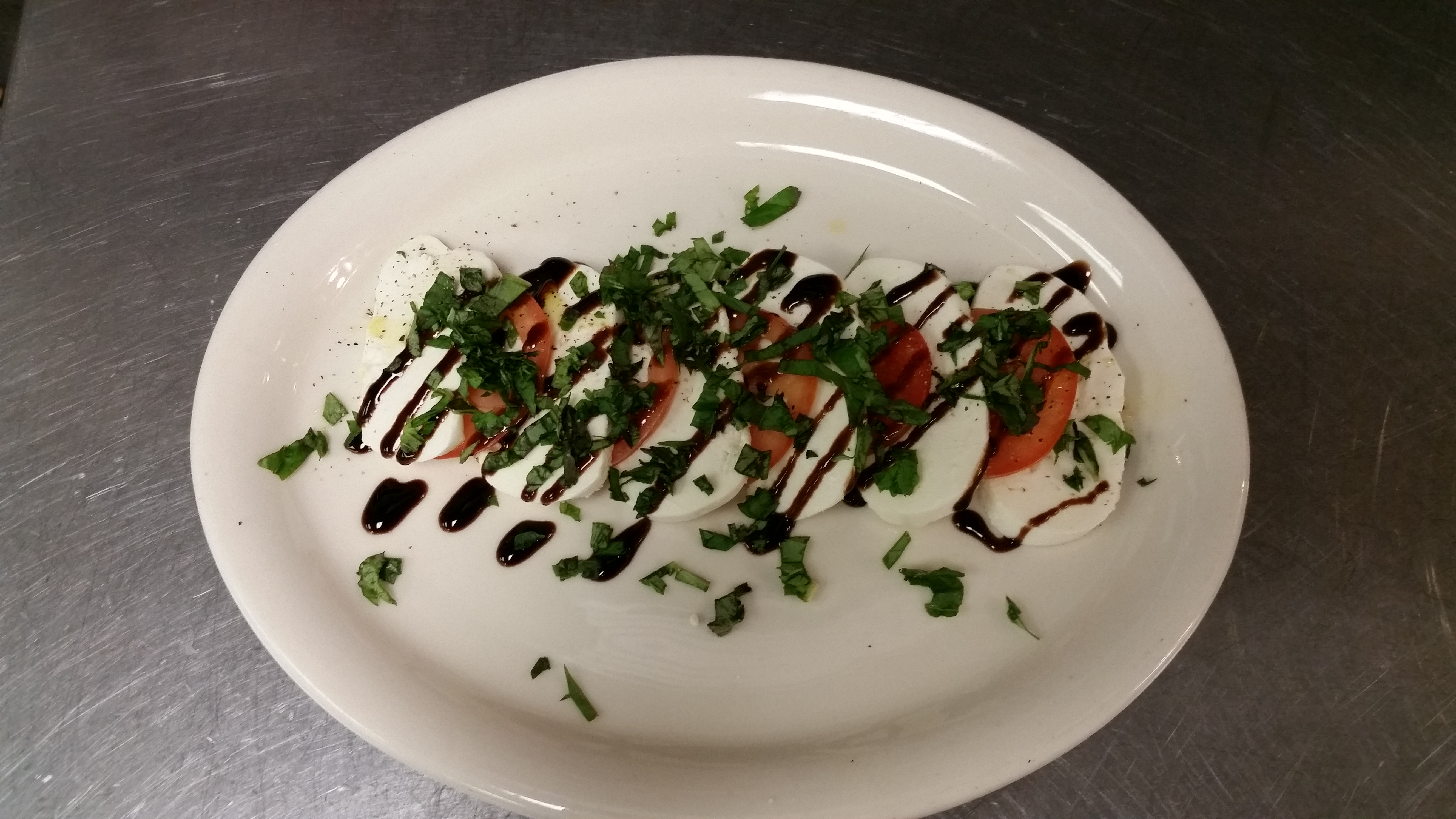 Order Caprese Salad food online from Rocco's New York Pizza store, North Las Vegas on bringmethat.com