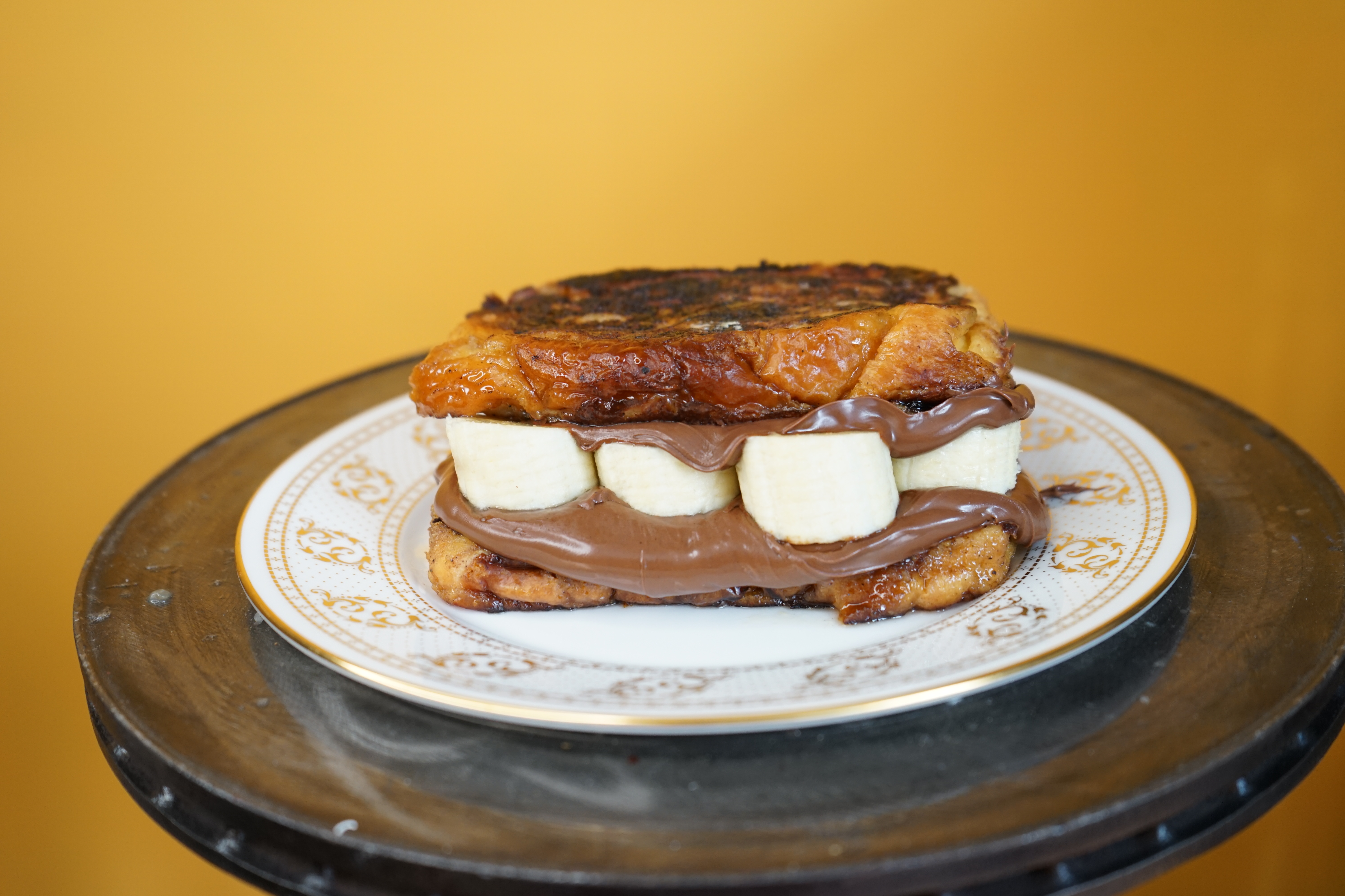 Order Banana Nutella French Toast Sandwich food online from Crepe Express store, Houston on bringmethat.com