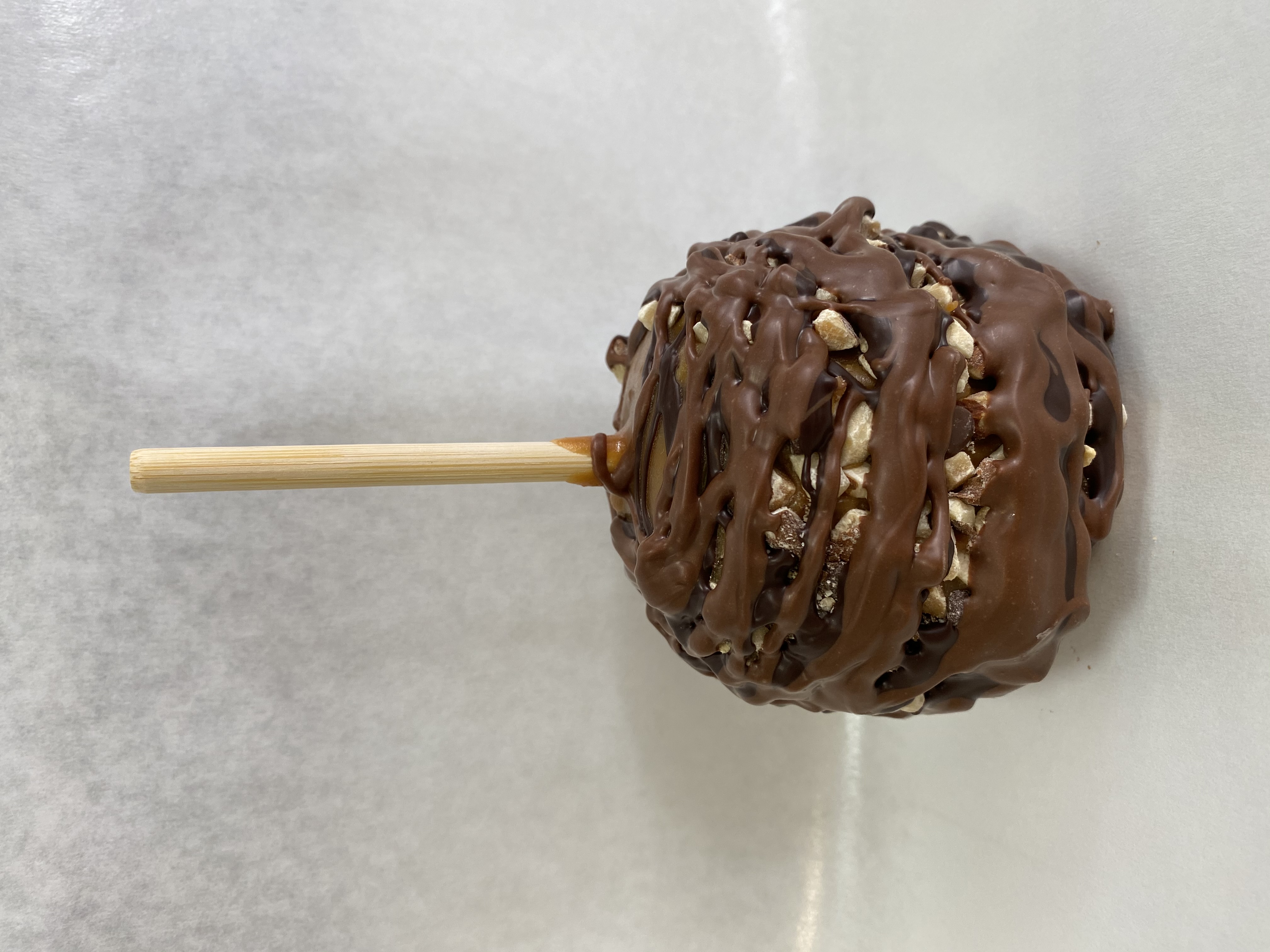 Order English Toffee Caramel Apple food online from Rocky Mountain Chocolate Factory store, Irvine on bringmethat.com
