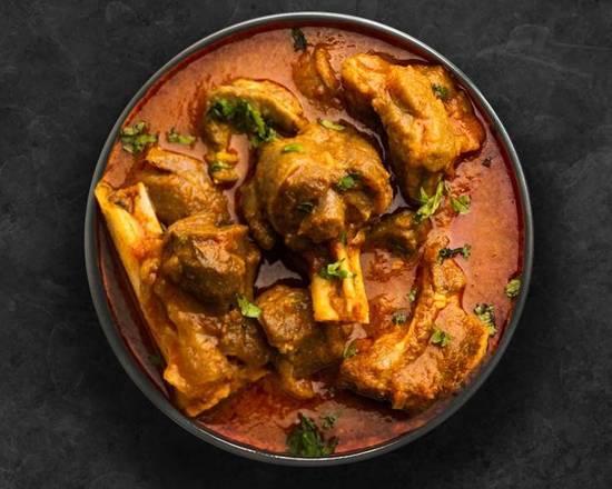 Order United Goat Curry food online from United Kitchens Of India store, Asheville on bringmethat.com