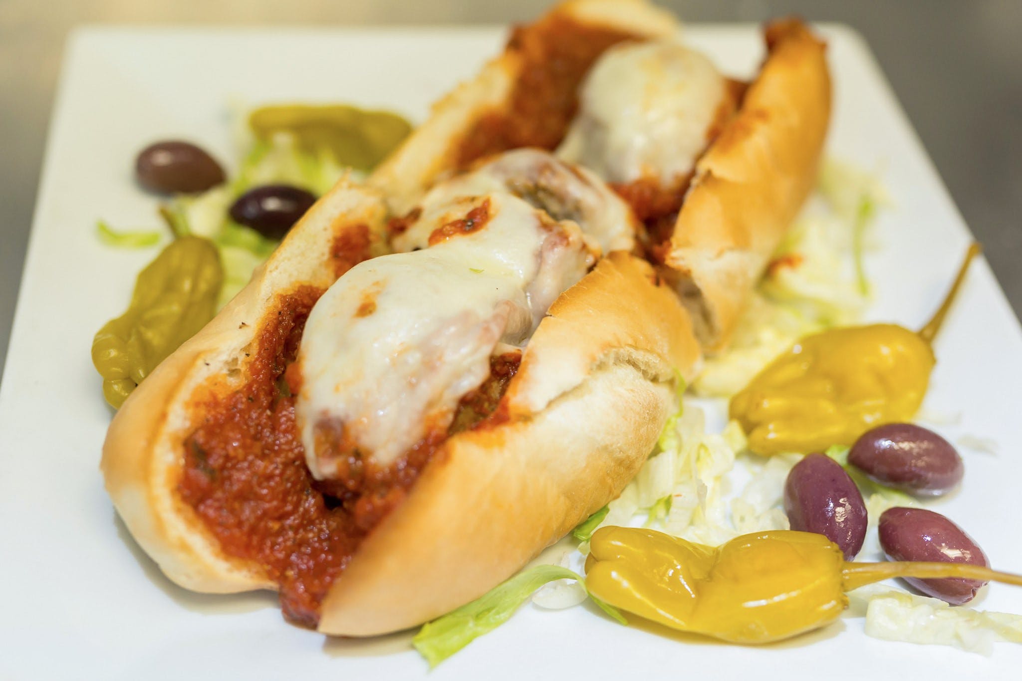 Order Meatball Parmigiana Sub - 9'' food online from Carmelo's Pizza, Pasta, Subs & More!! store, Linthicum Heights on bringmethat.com