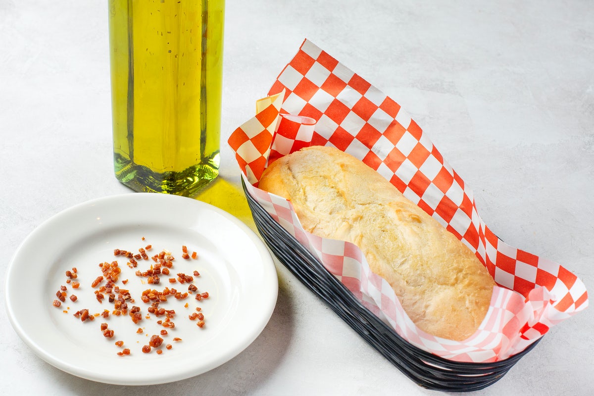 Order ADD ADDITIONAL BREAD (TWO HALF LOAVES) food online from Johnny Carino store, Midland on bringmethat.com