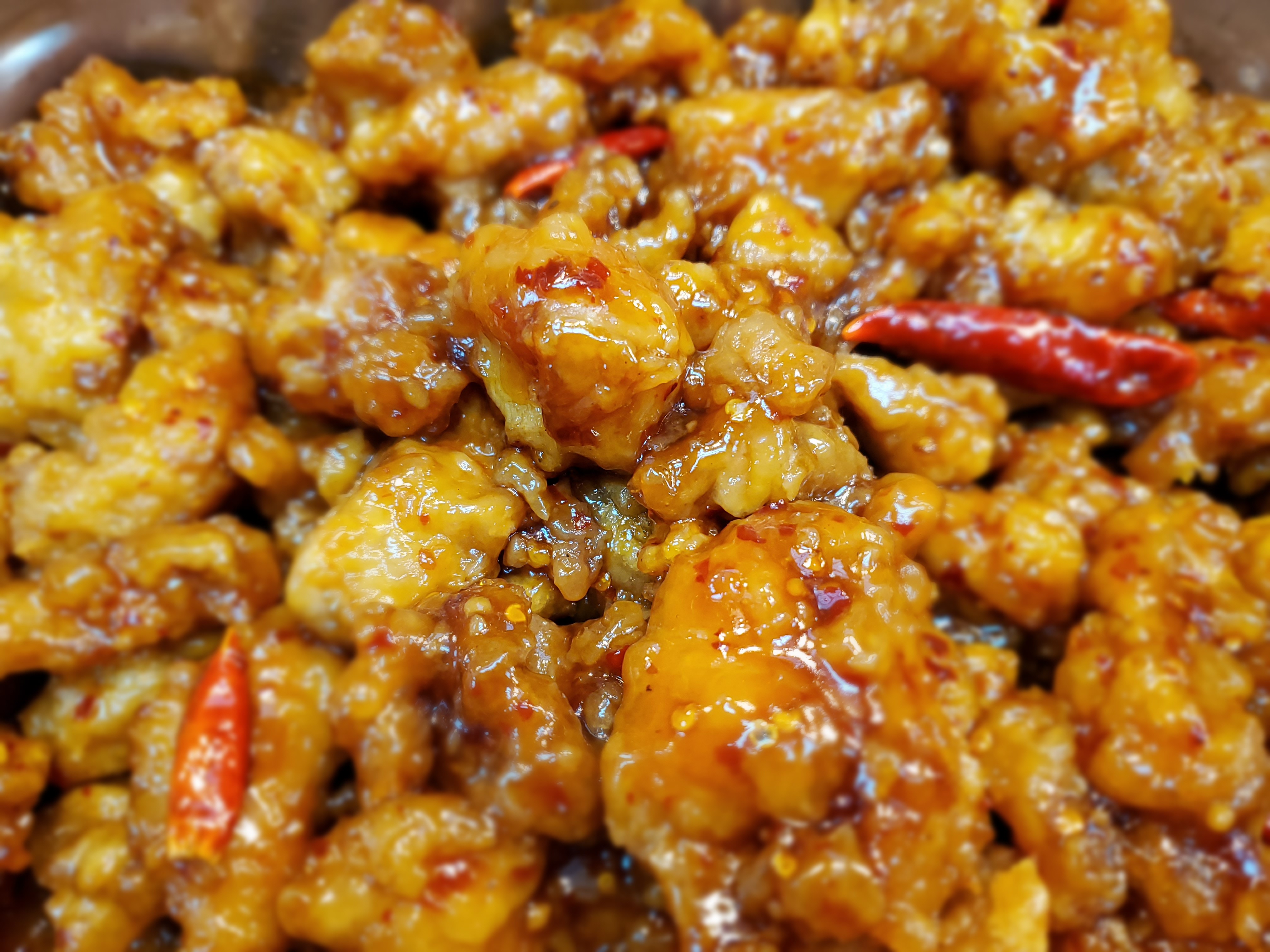 Order General Tao's Chicken food online from Famous Wok 5th Ave Mall store, Anchorage on bringmethat.com