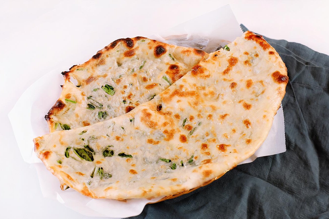 Order Spinach Naan food online from Om Indian Cuisine store, San Francisco on bringmethat.com