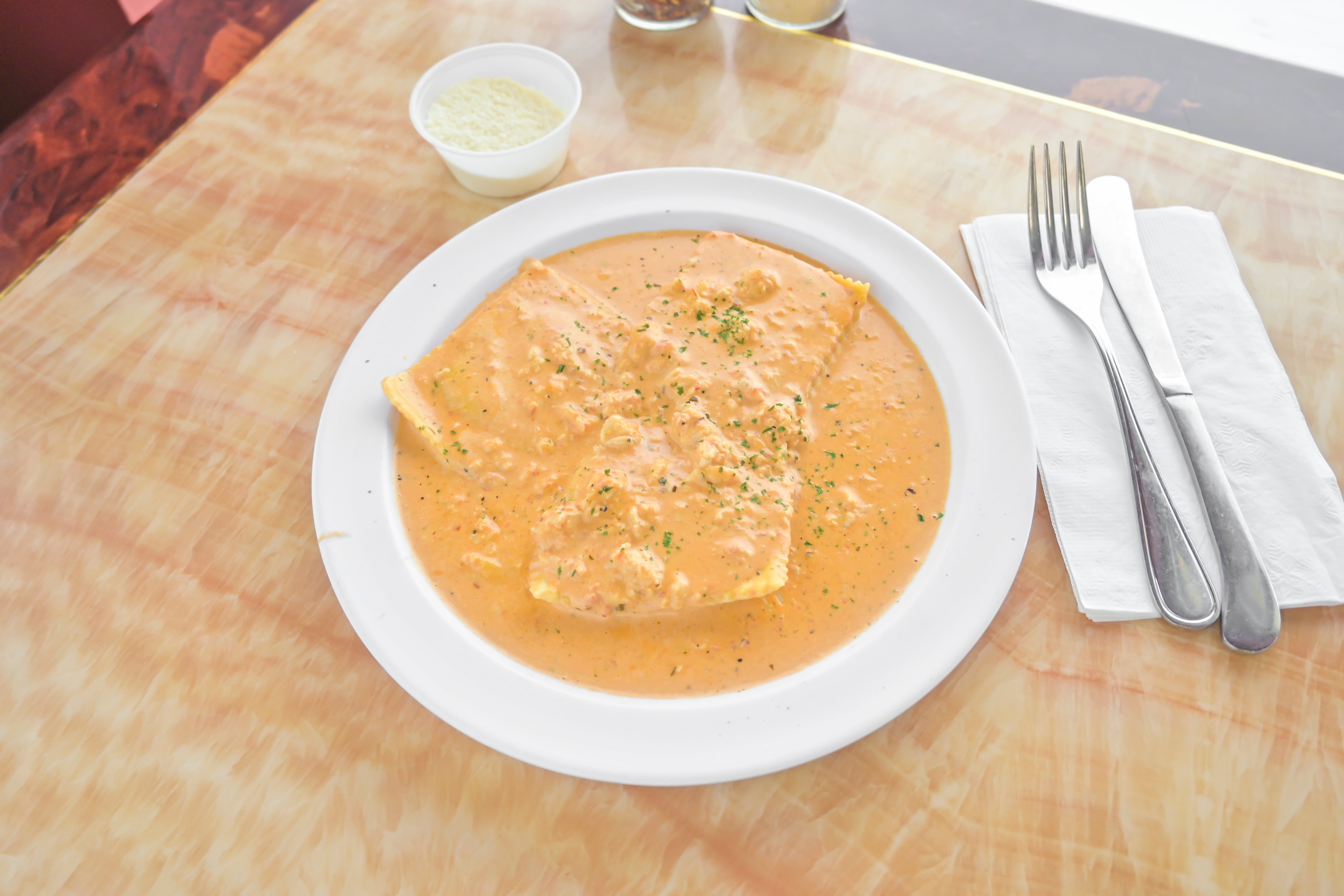 Order Ravioli with Crab Meat - 6 Pieces food online from Tuscan Pizza store, Sicklerville on bringmethat.com