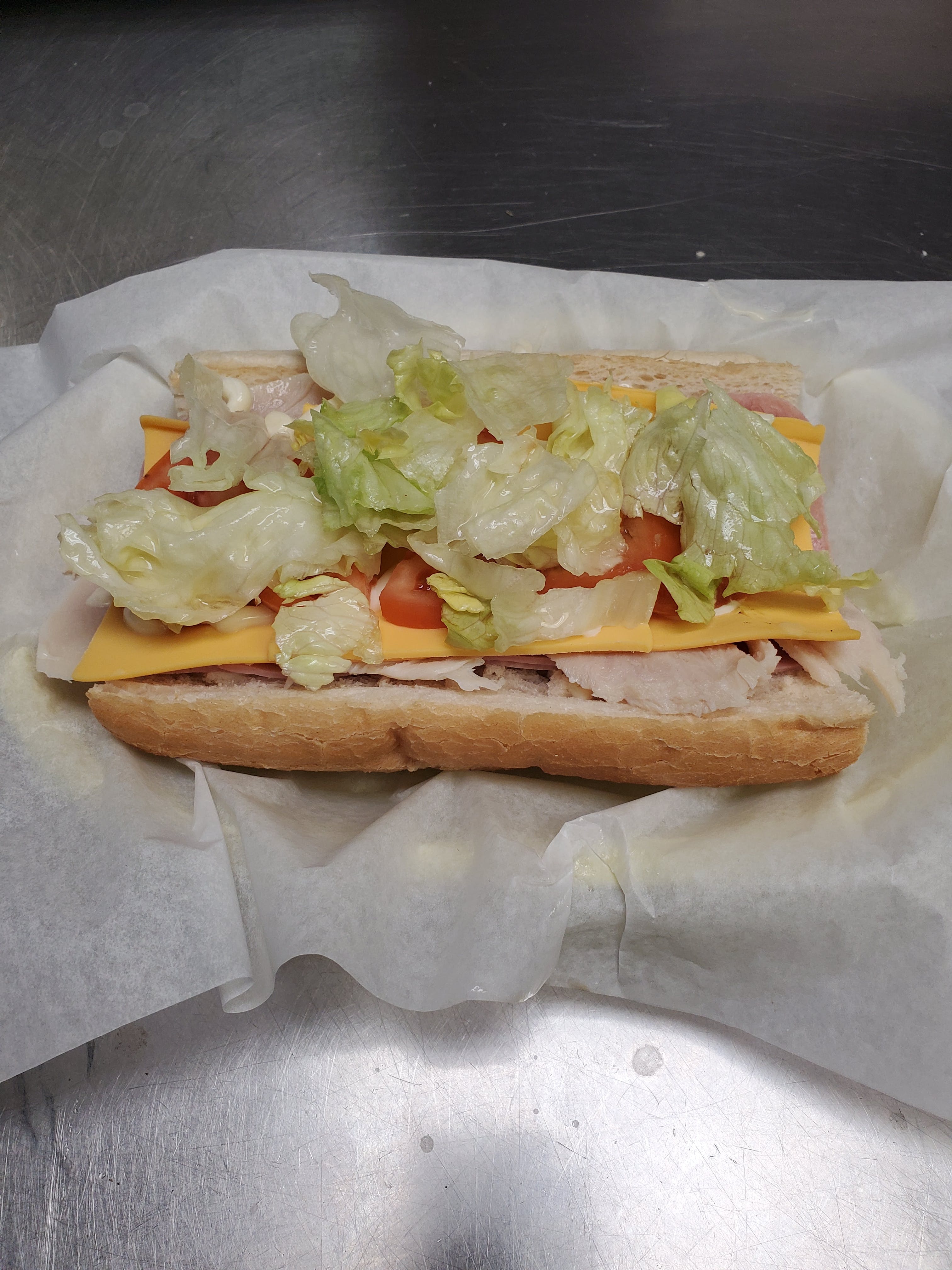 Order American Sub - Sub food online from Pizza Cucina store, Oswego on bringmethat.com