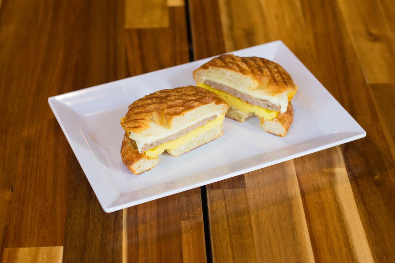 Order Croissant,Sausage, Omelet Patty and White American Cheese Breakfast food online from Iguana Cafe store, Chicago on bringmethat.com
