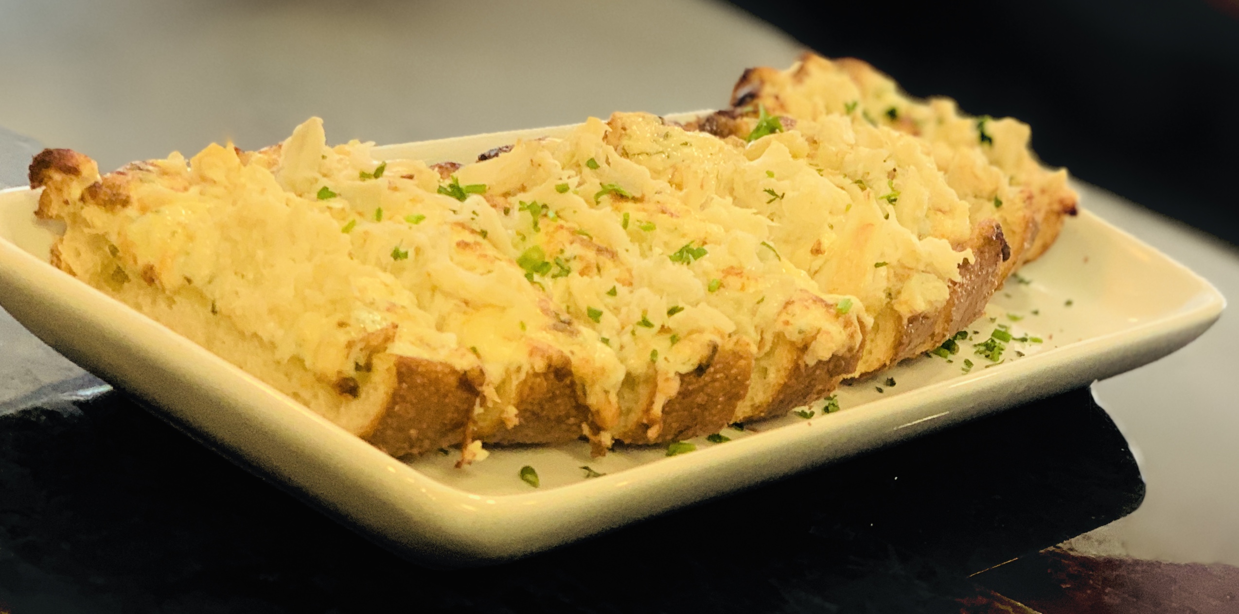 Order Dungeness Crab Cheese Bread food online from Anchors Fish & Chips And Seafood Grill store, San Jose on bringmethat.com