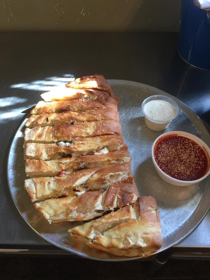 Order Single Topping Calzone - Calzone food online from Cove At Lake Blackshear store, Cordele on bringmethat.com