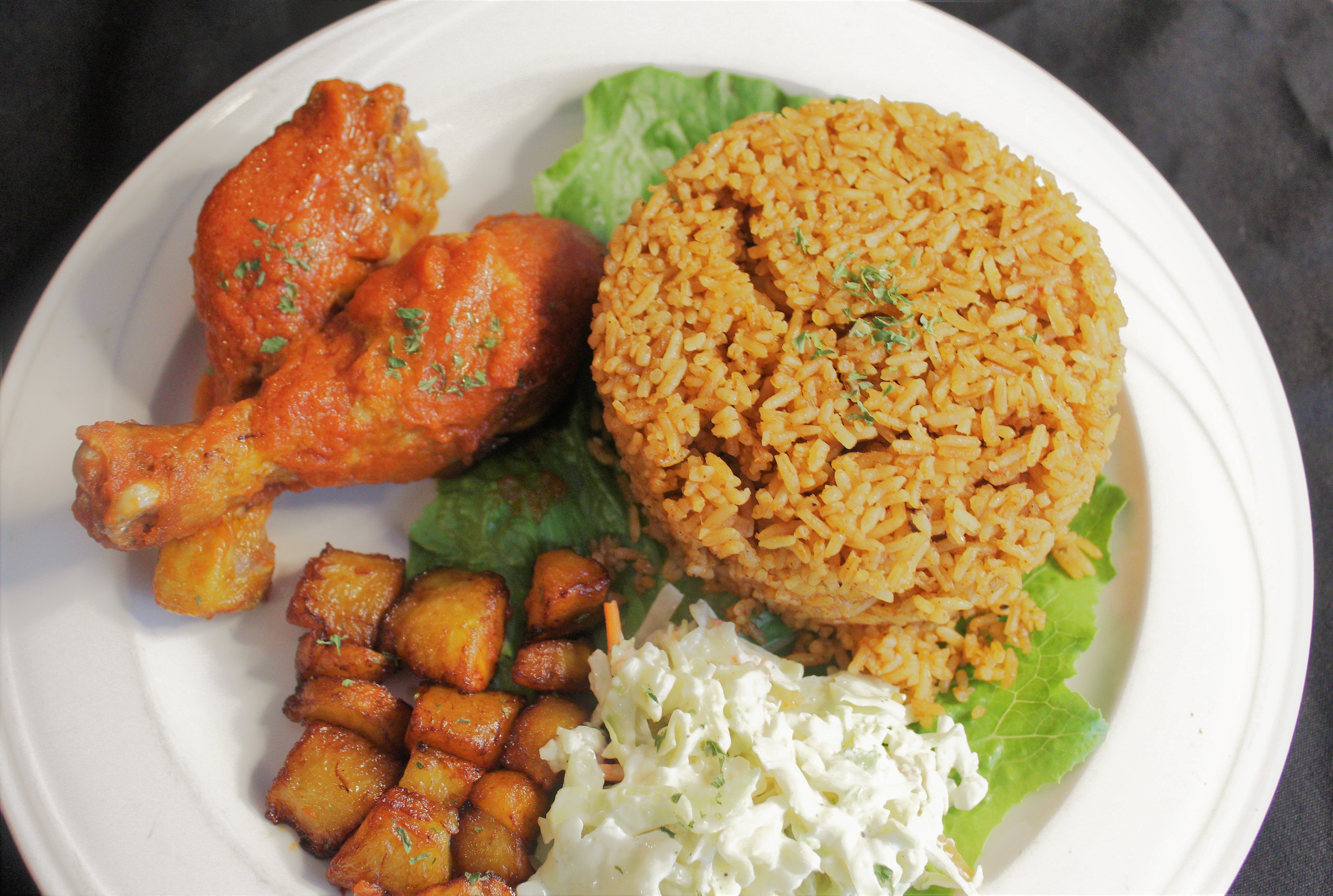 Order Jollof Rice food online from The Spice Grille store, Moorhead on bringmethat.com