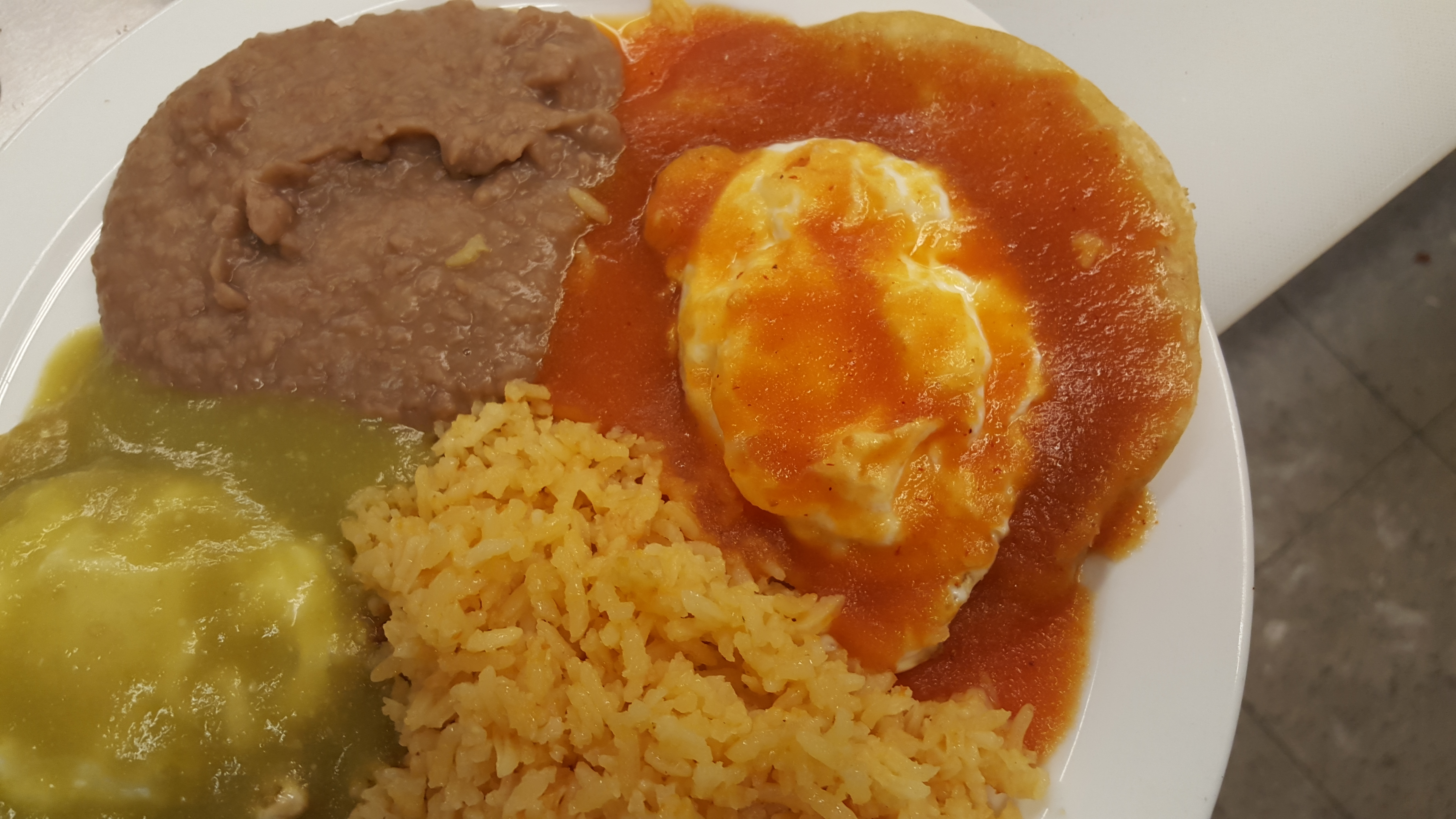 Order Huevos Rancheros food online from Chilangos Authentic Mexican Cuisine store, Rockford on bringmethat.com