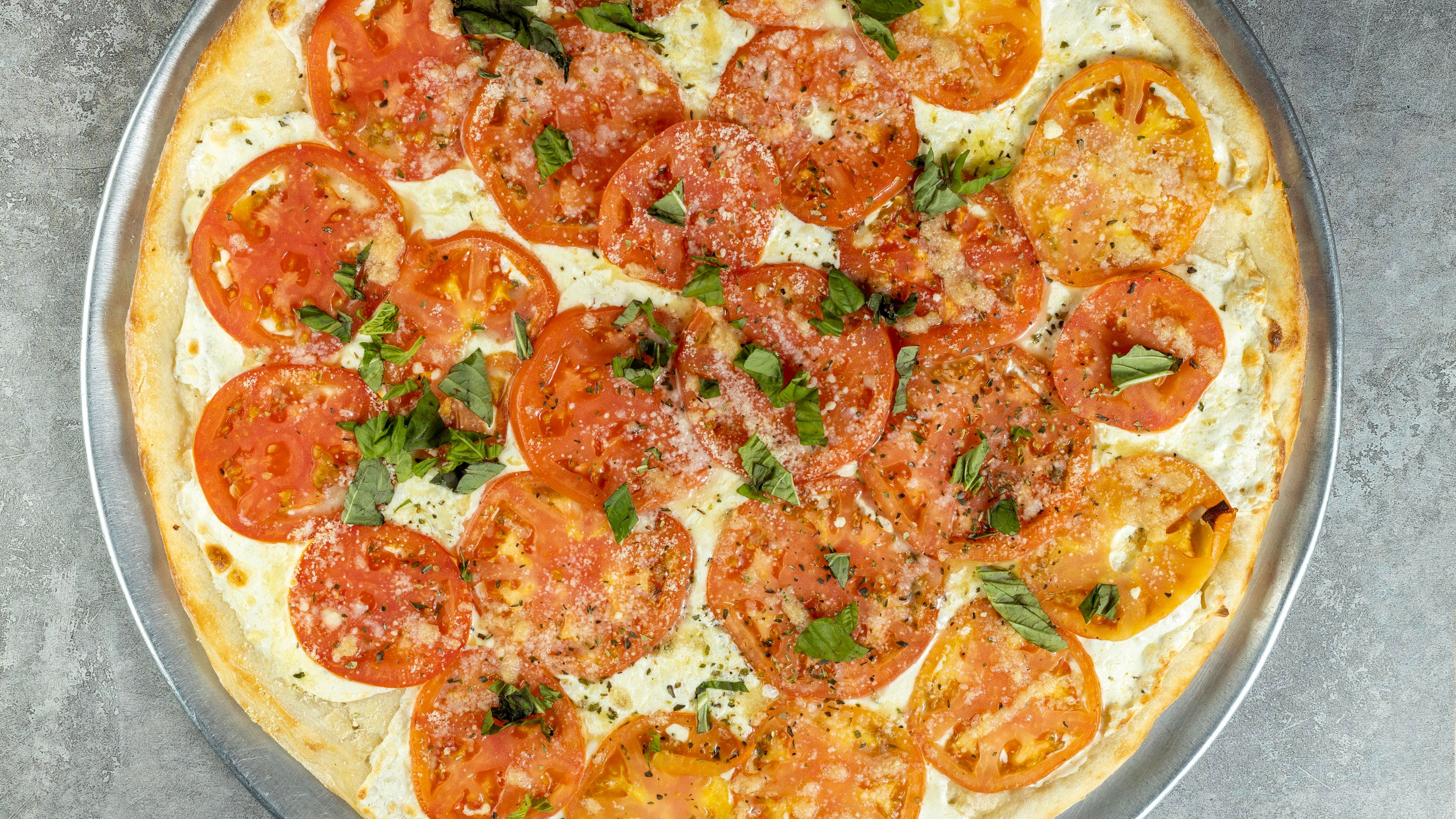 Order Fresh Mozzarella Cheese & Tomato Pizza - Mini Personal food online from Regina Pizza store, Lynbrook on bringmethat.com