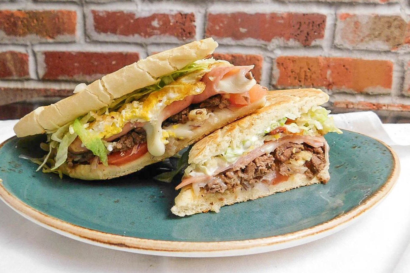 Order Chivito Pressed Sandwich food online from Cafecito store, Chicago on bringmethat.com