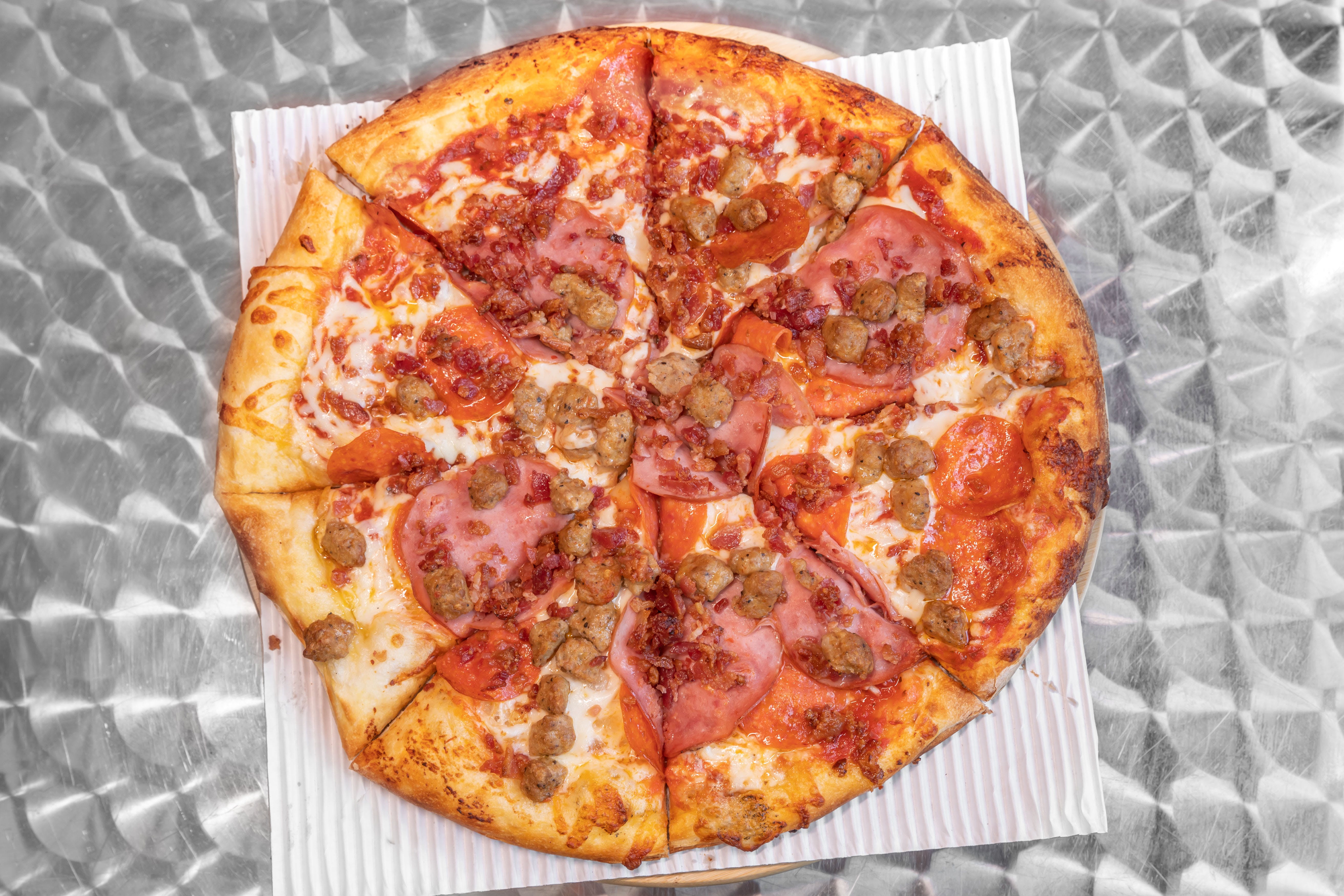 Order Meat Lovers Pizza - Medium 12'' food online from Promenade Pizza store, Anaheim on bringmethat.com