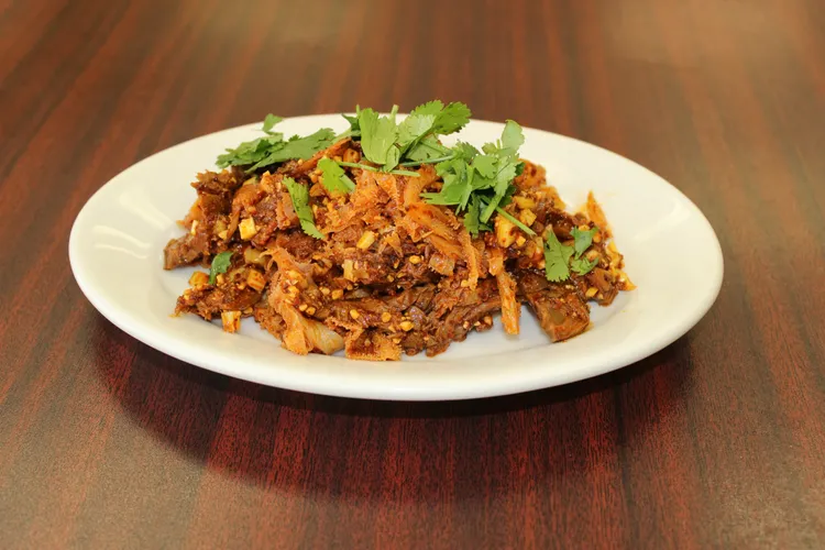 Order 2. Beef and Tripe Medley 夫妻肺片 food online from North Village Chinese Restaurant store, Dayton on bringmethat.com