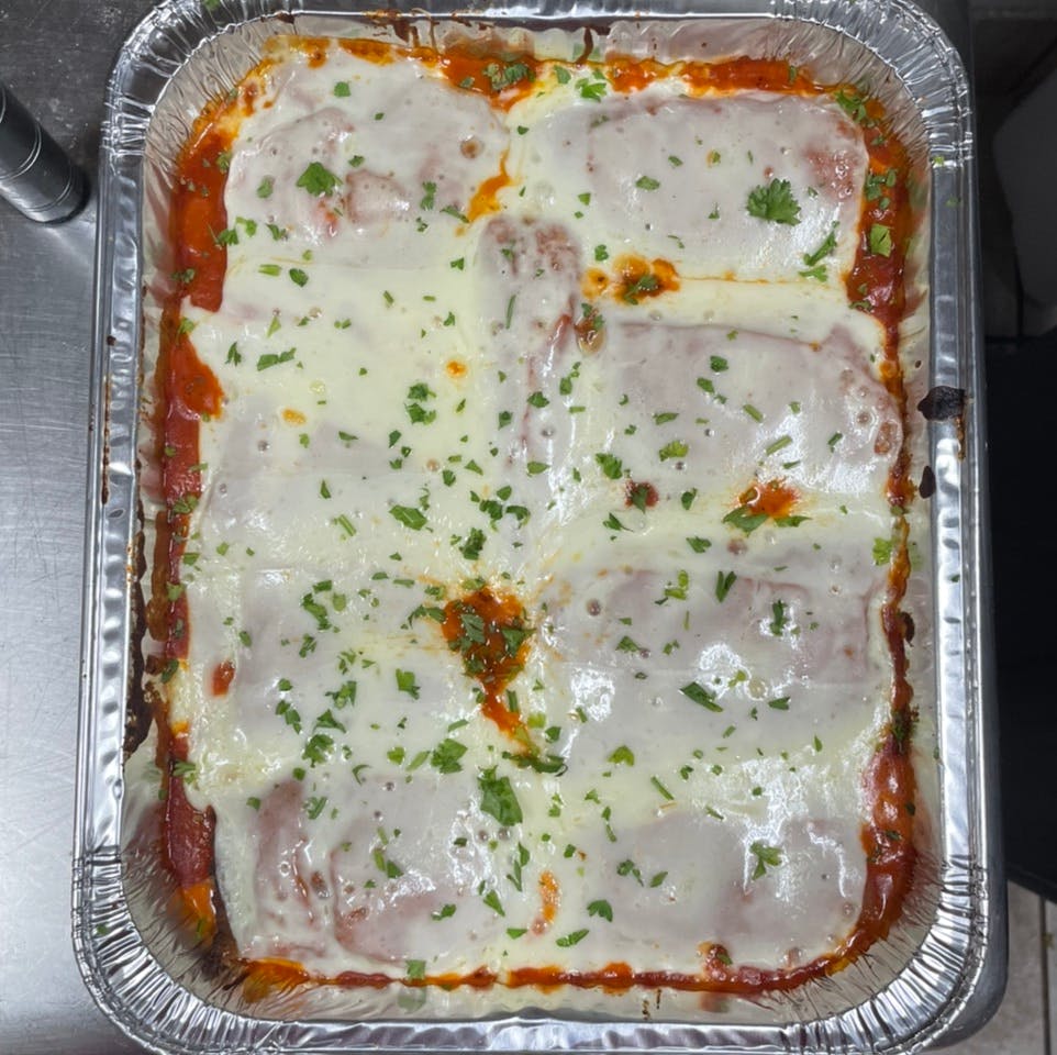 Order Eggplant Parmigiana Catering - Half Tray food online from Davila's Pizza & Restaurant store, Hackettstown on bringmethat.com