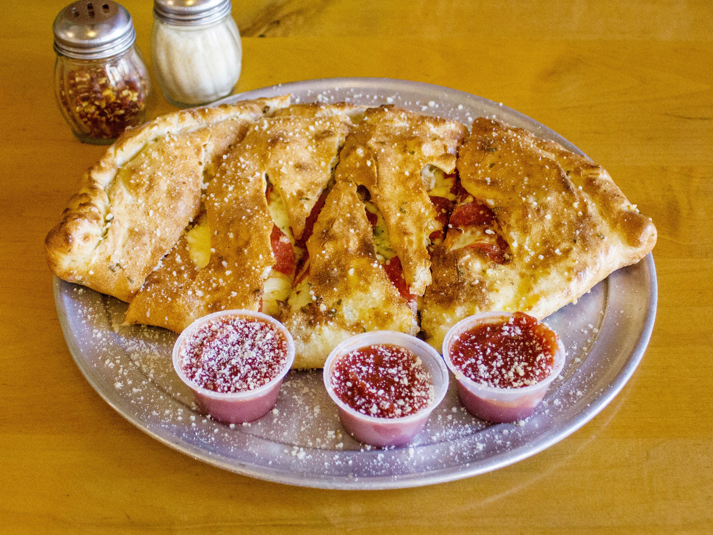 Order The Fat Calzone food online from Fatty's Pizza store, Macon on bringmethat.com