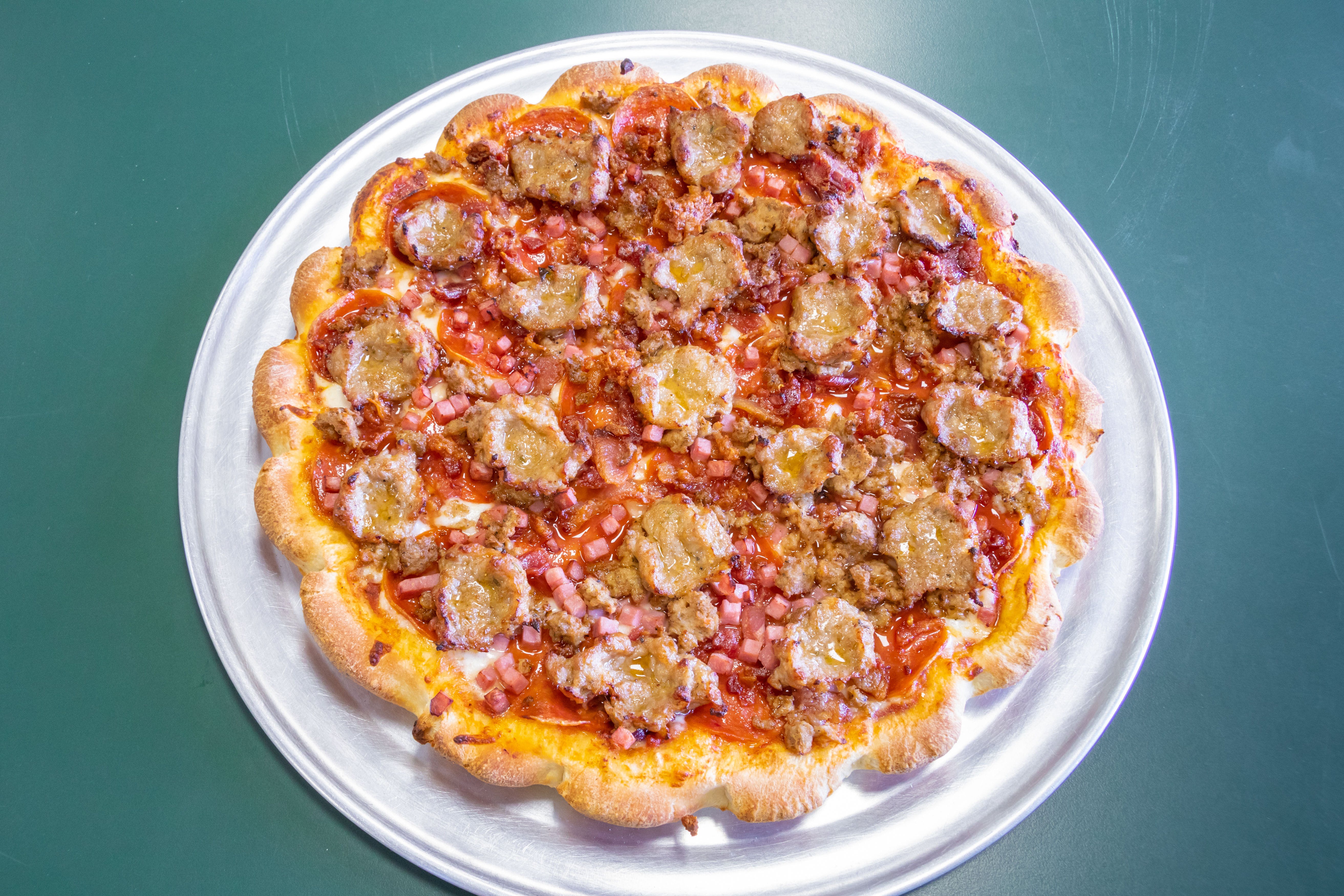 Order Meat Lover's Pizza - Small 9'' (6 Slices) food online from Casamel's Pizza store, Parma on bringmethat.com
