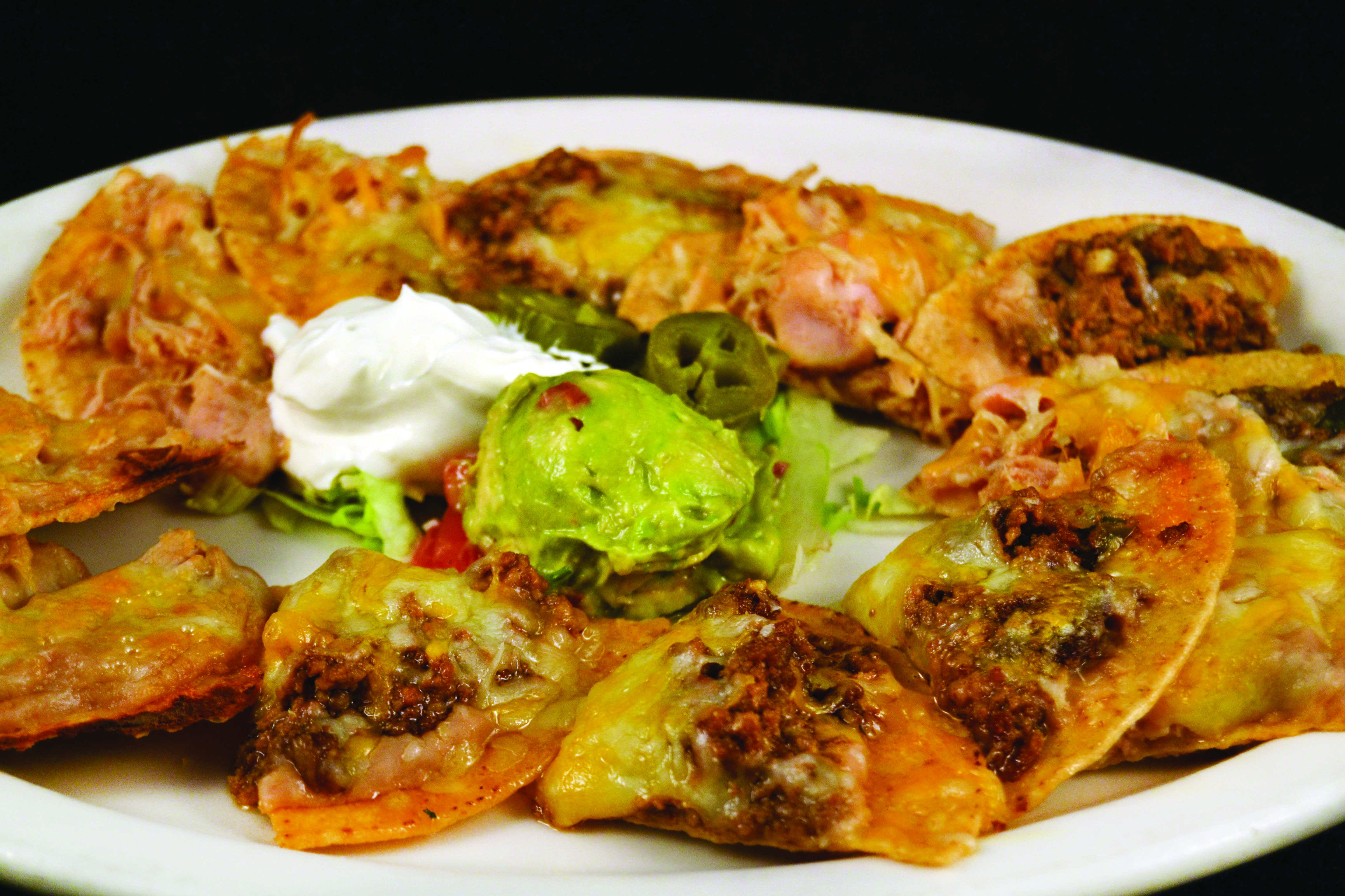 Order NACHOS food online from Mi Comal Mexican Restaurant store, Irving on bringmethat.com