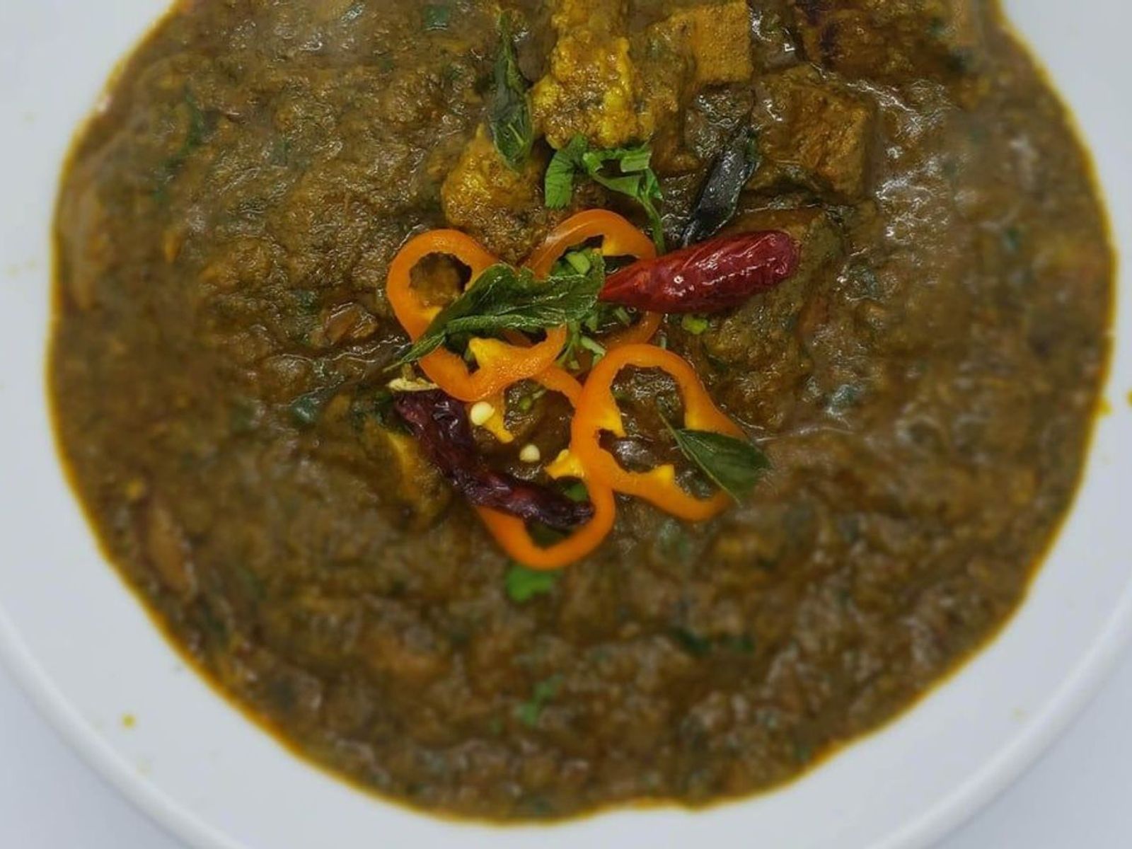 Order Gongura Mutton Curry food online from Indian Cuisine store, Philadelphia on bringmethat.com