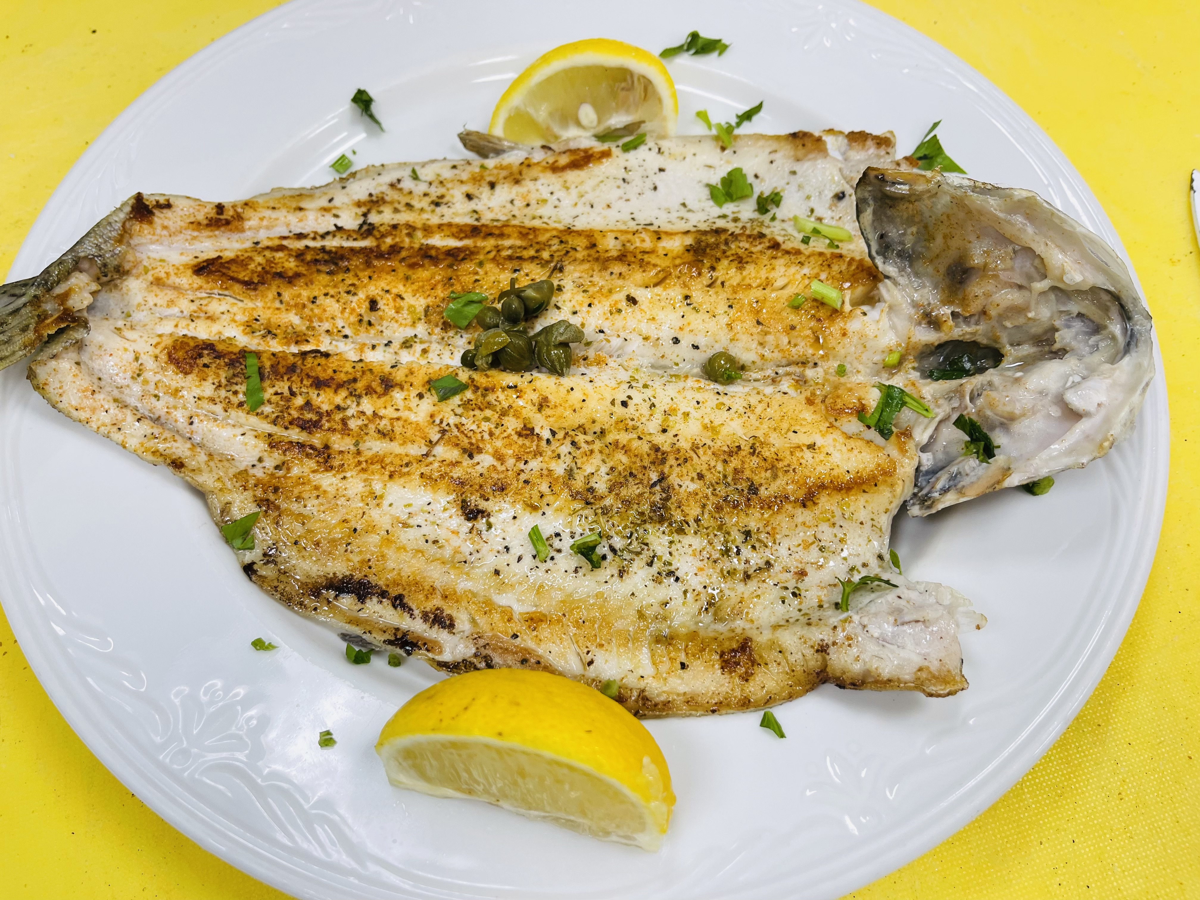 Order RAINBOW TROUT w/ 2 sides food online from Trapezaria Kuzina store, Rockville on bringmethat.com