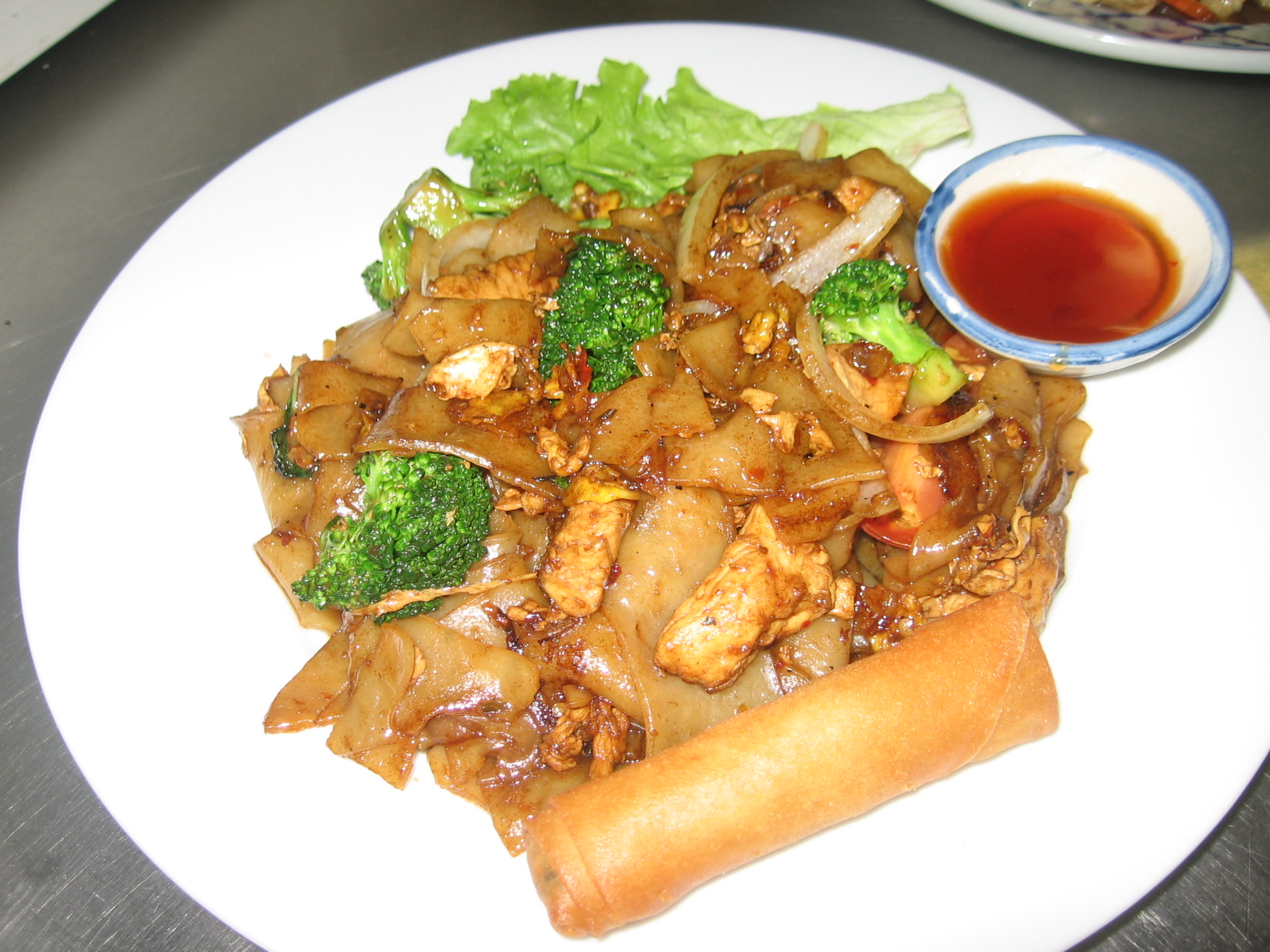 Order Pad Kee Mao (Drunken Noodle)* food online from Thai Orchid Restaurant store, ADDISON on bringmethat.com