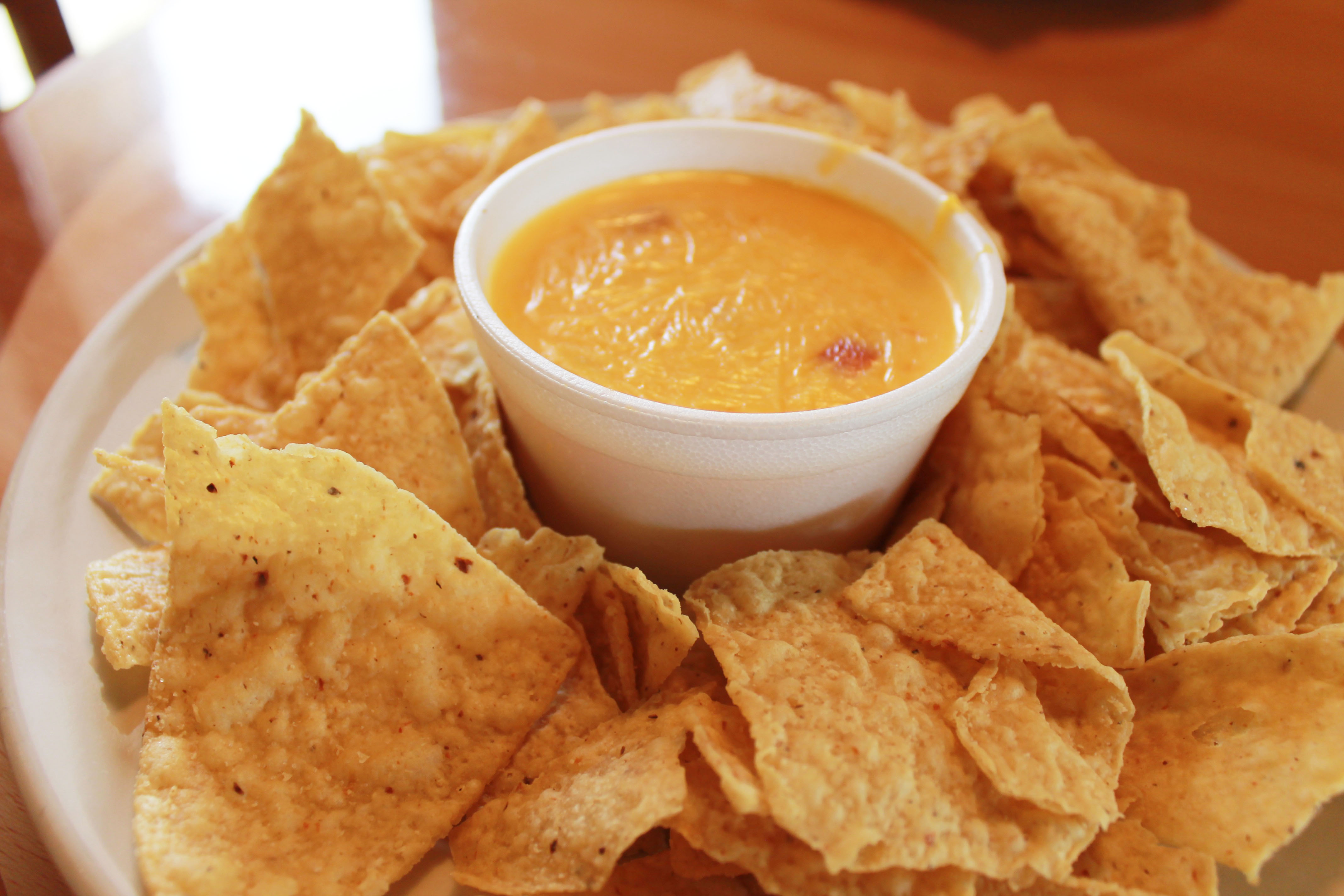 Order Tortilla Chips and Homemade Queso  food online from Pecan St. Station Deli And Grill store, Pflugerville on bringmethat.com