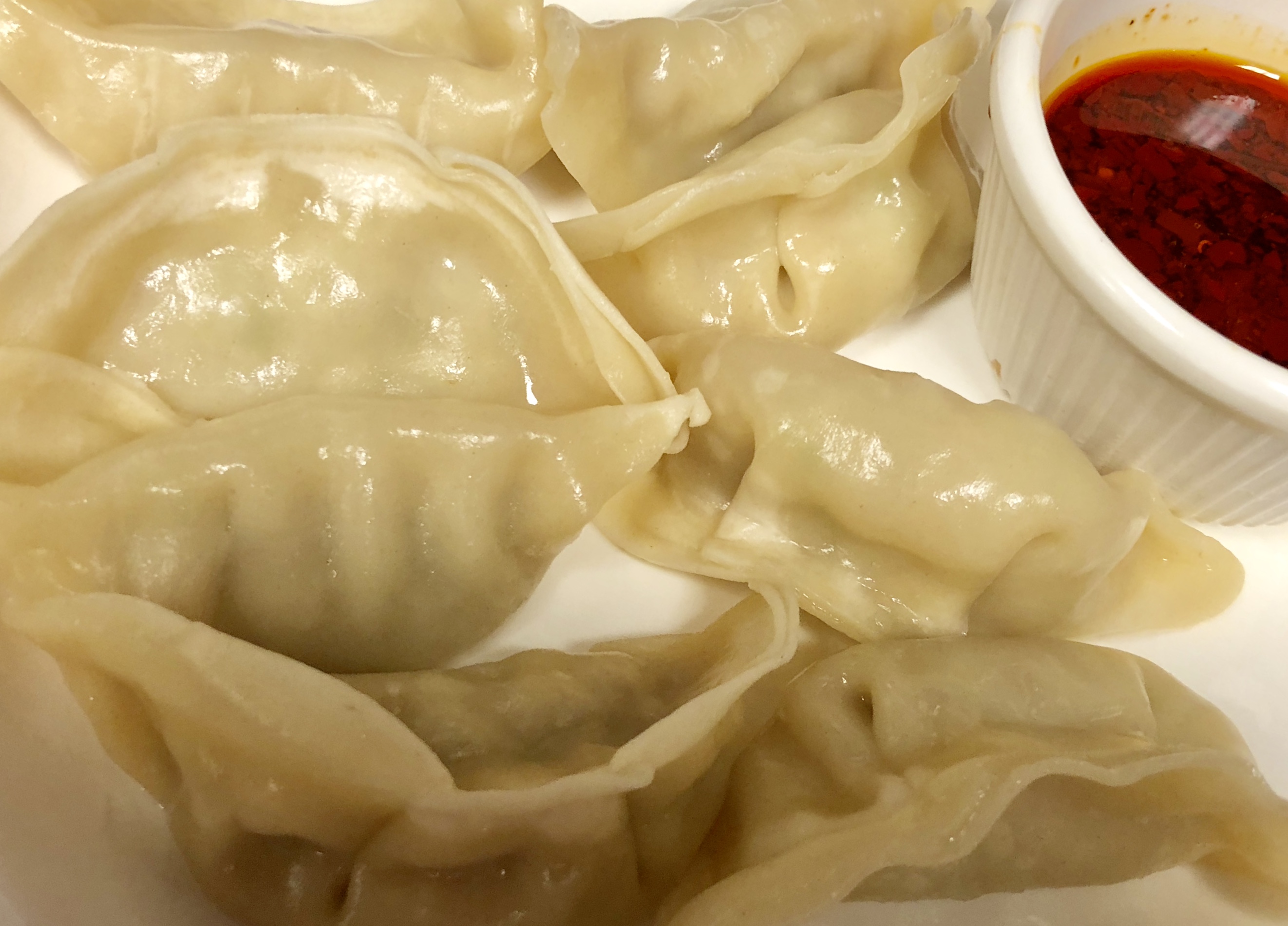 Order A4. Steamed Pork Dumpling(8) 水饺 food online from East Wall Chinese Cuisine store, Plano on bringmethat.com