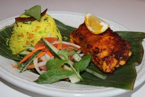 Order Grilled spice rubbed salmon on the bed of Chennai Lemon Rice food online from Southern Spice store, New Hyde Park on bringmethat.com