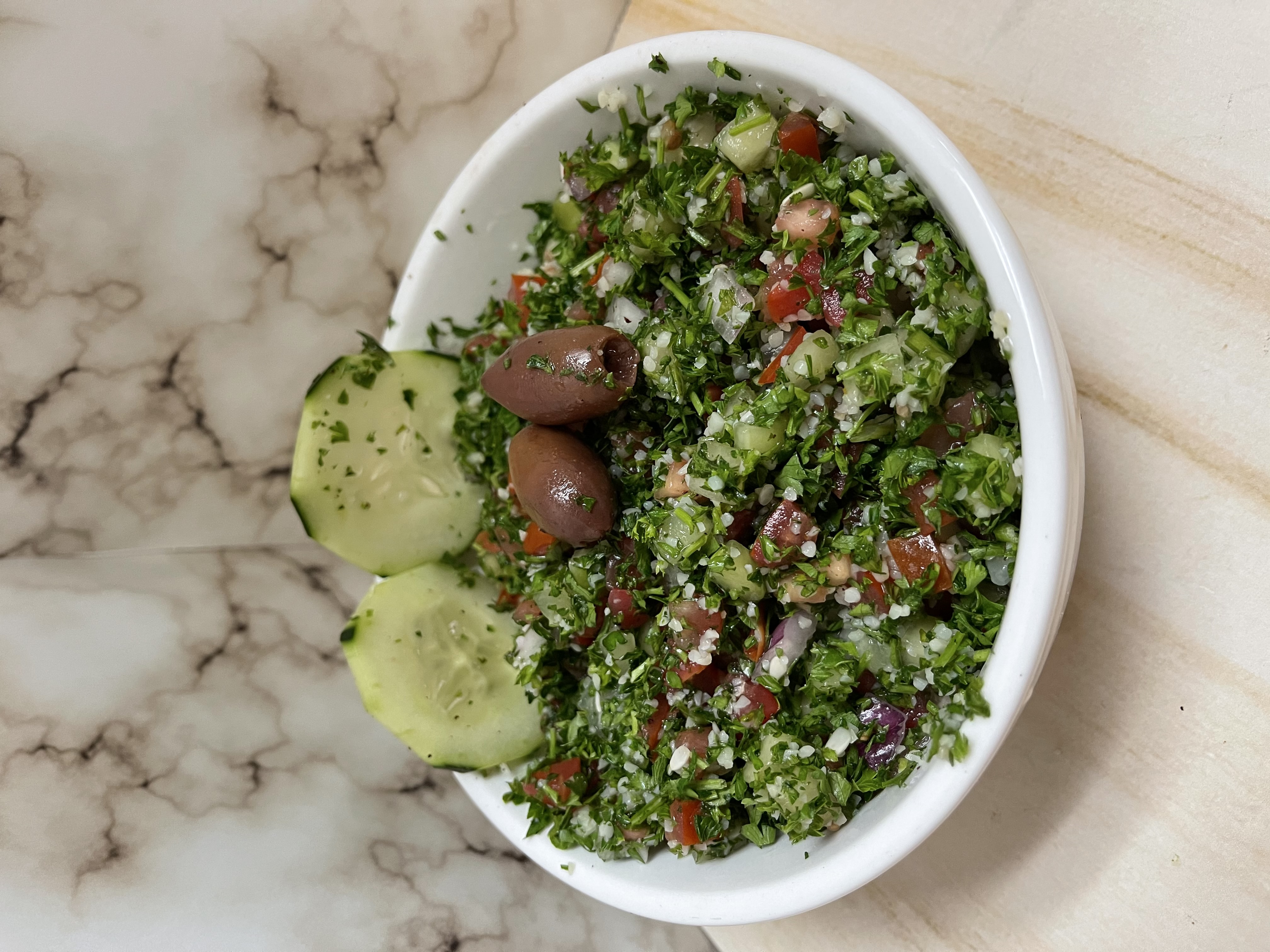 Order Tabbouleh Salad food online from Yasmines Cafe store, Albuquerque on bringmethat.com