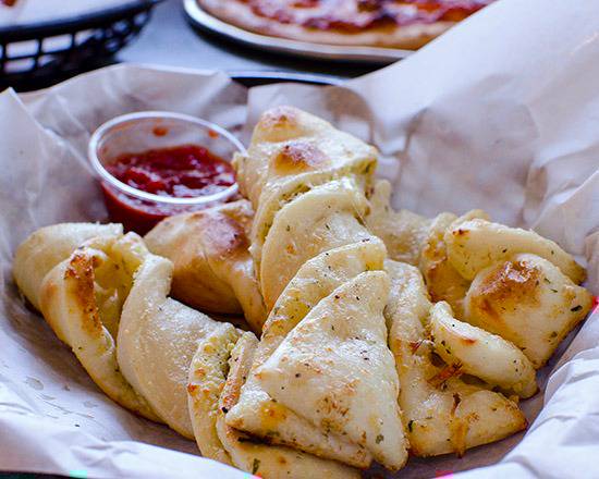 Order Garlic Parmesan Twists food online from Round Table Pizza store, CERES on bringmethat.com