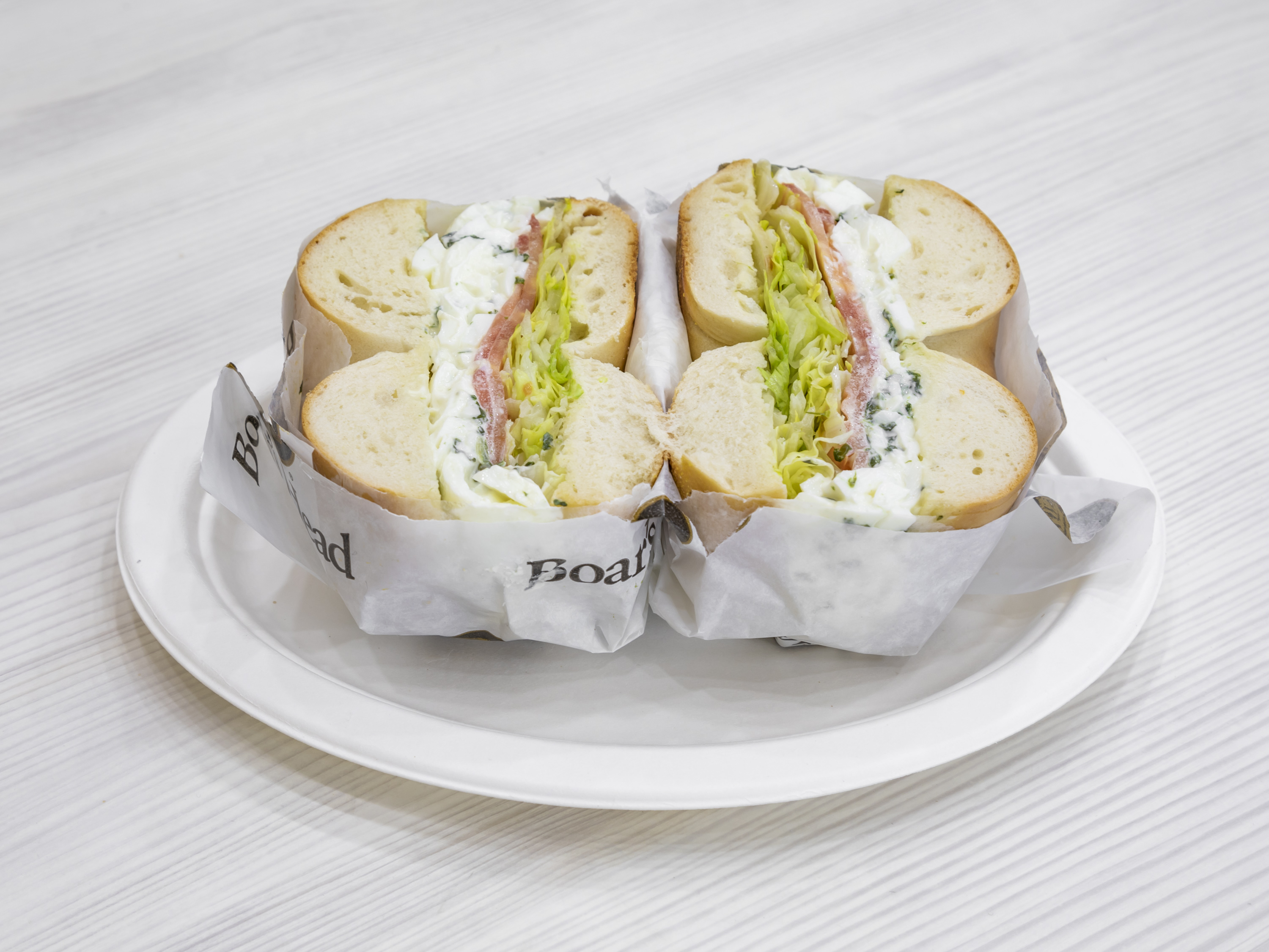 Order Lite Spinach Egg White Salad Sandwich food online from Bagel Boss Catering store, New York on bringmethat.com