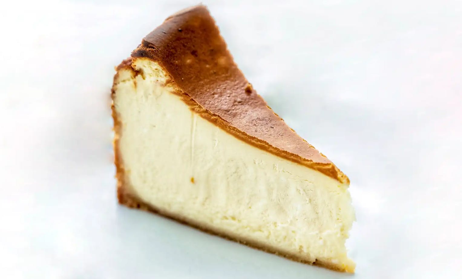 Order New York Style Cheesecake - Slice food online from Breakfast Pizza store, San Francisco on bringmethat.com