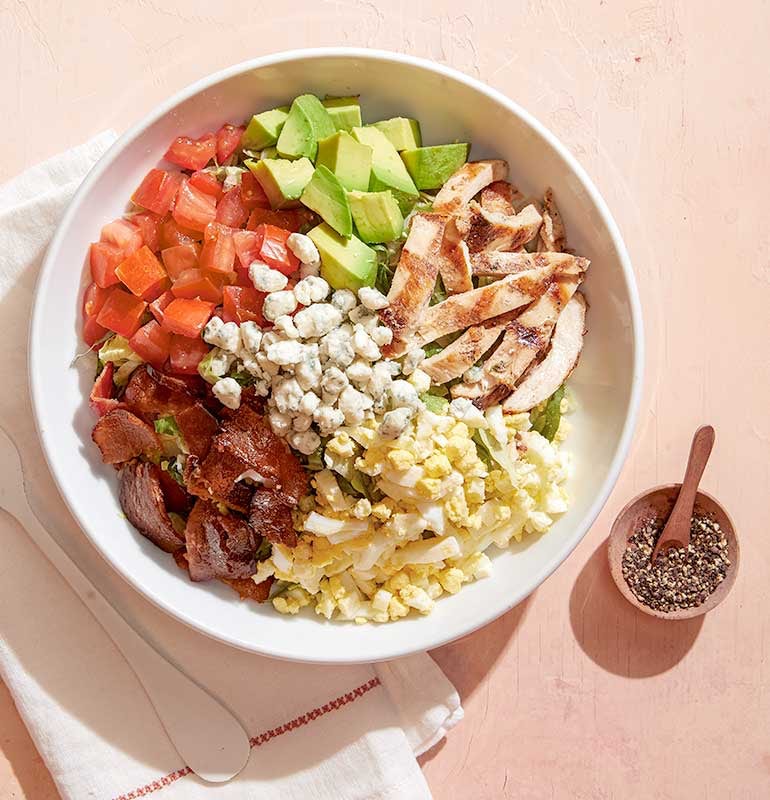 Order CALIFORNIA COBB food online from California Pizza Kitchen store, Hollywood on bringmethat.com