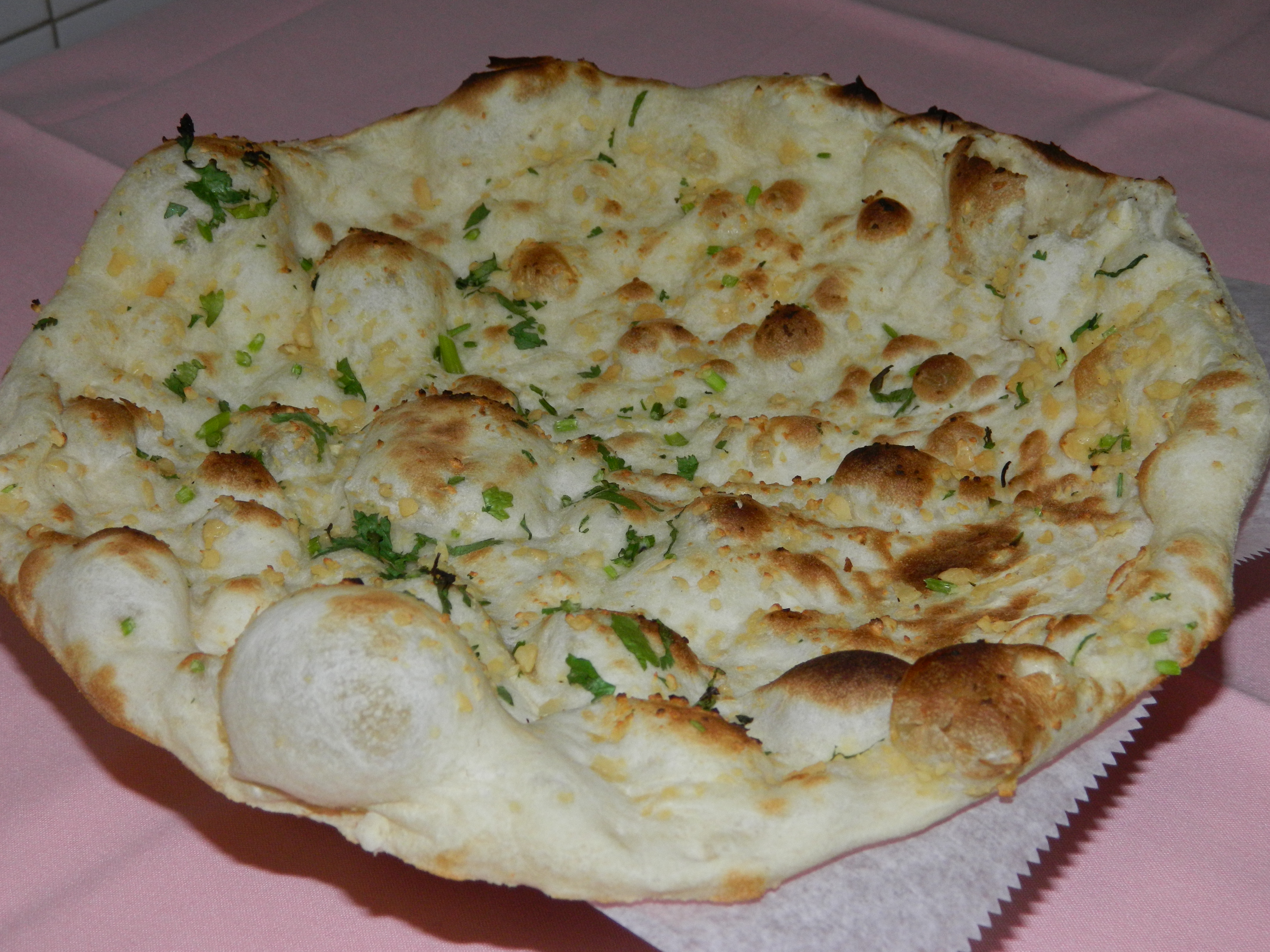 Order Garlic Naan food online from Mughal Palace store, Valhalla on bringmethat.com